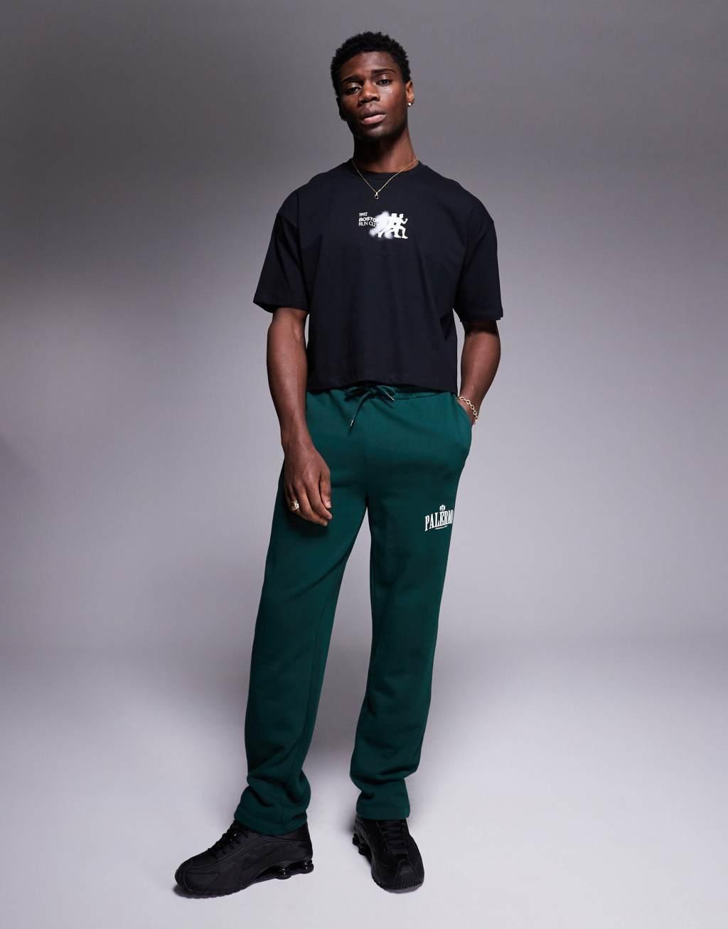 ASOS DESIGN cropped oversized t-shirt with sports chest print in black Product Image