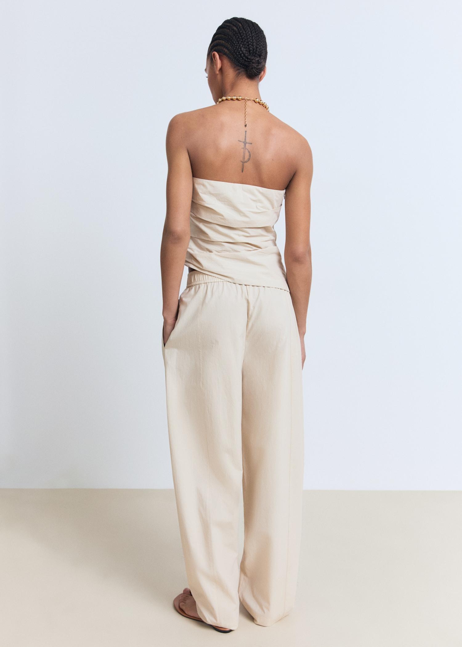 Asymmetrical strapless top - Women | MANGO USA Product Image