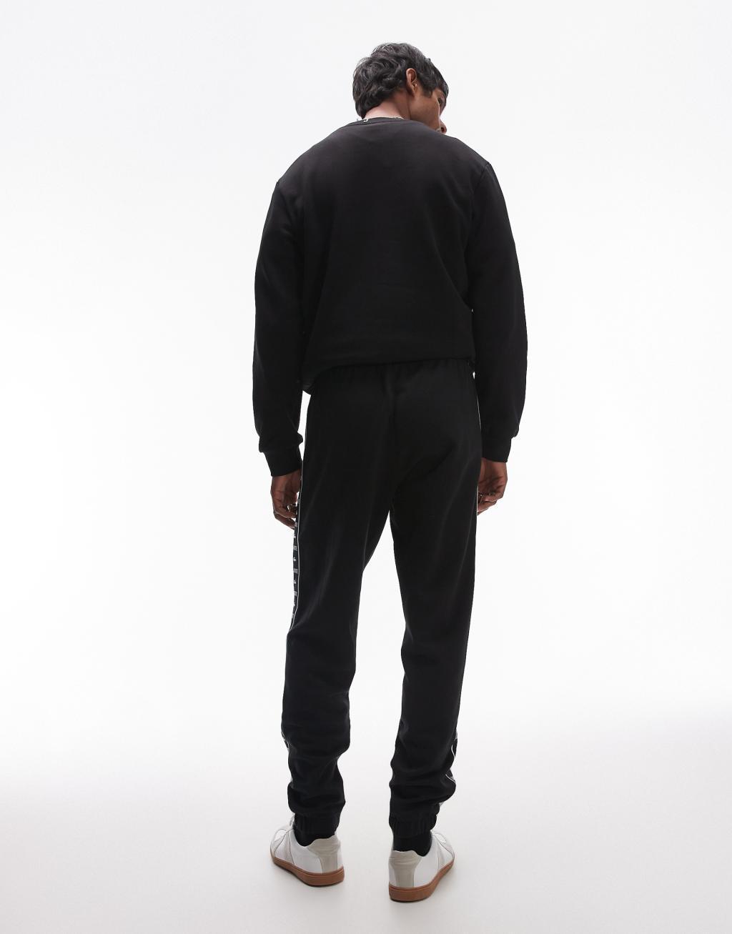 Lacoste logo stripe sweatpants in black  Product Image