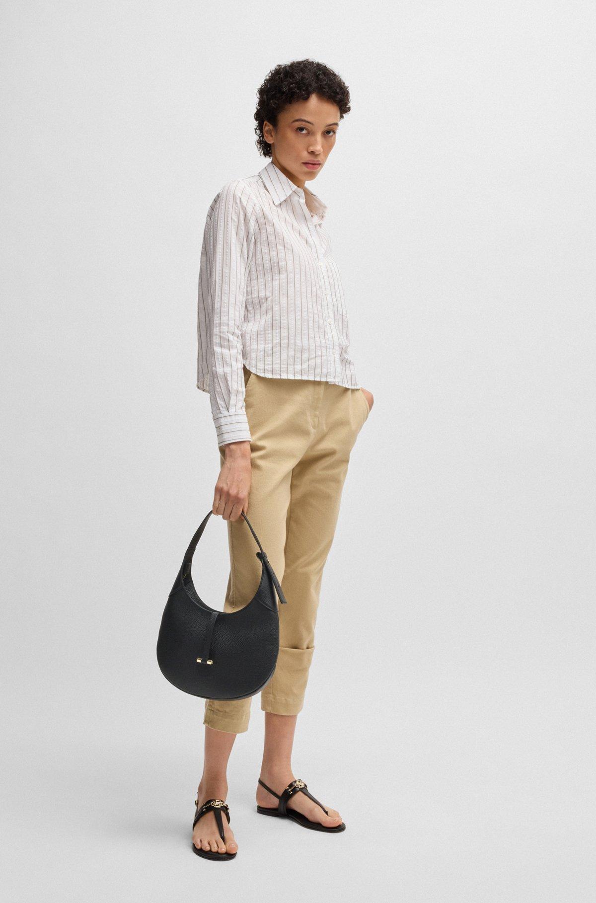 Pebbled-leather hobo bag with golden hardware Product Image