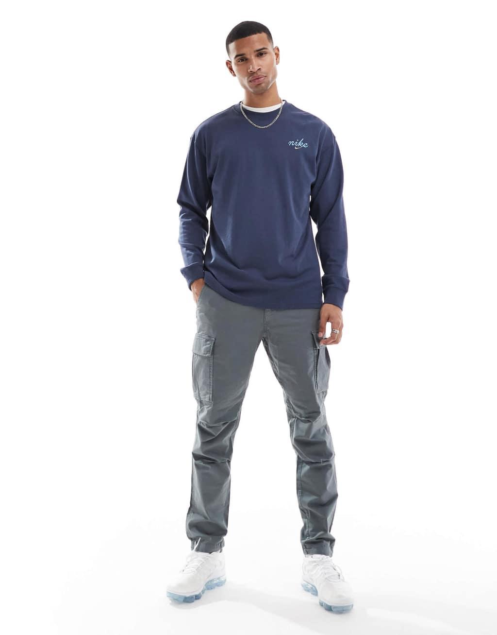 Nike Doodle Swoosh graphic longsleeve t-shirt in dark blue Product Image