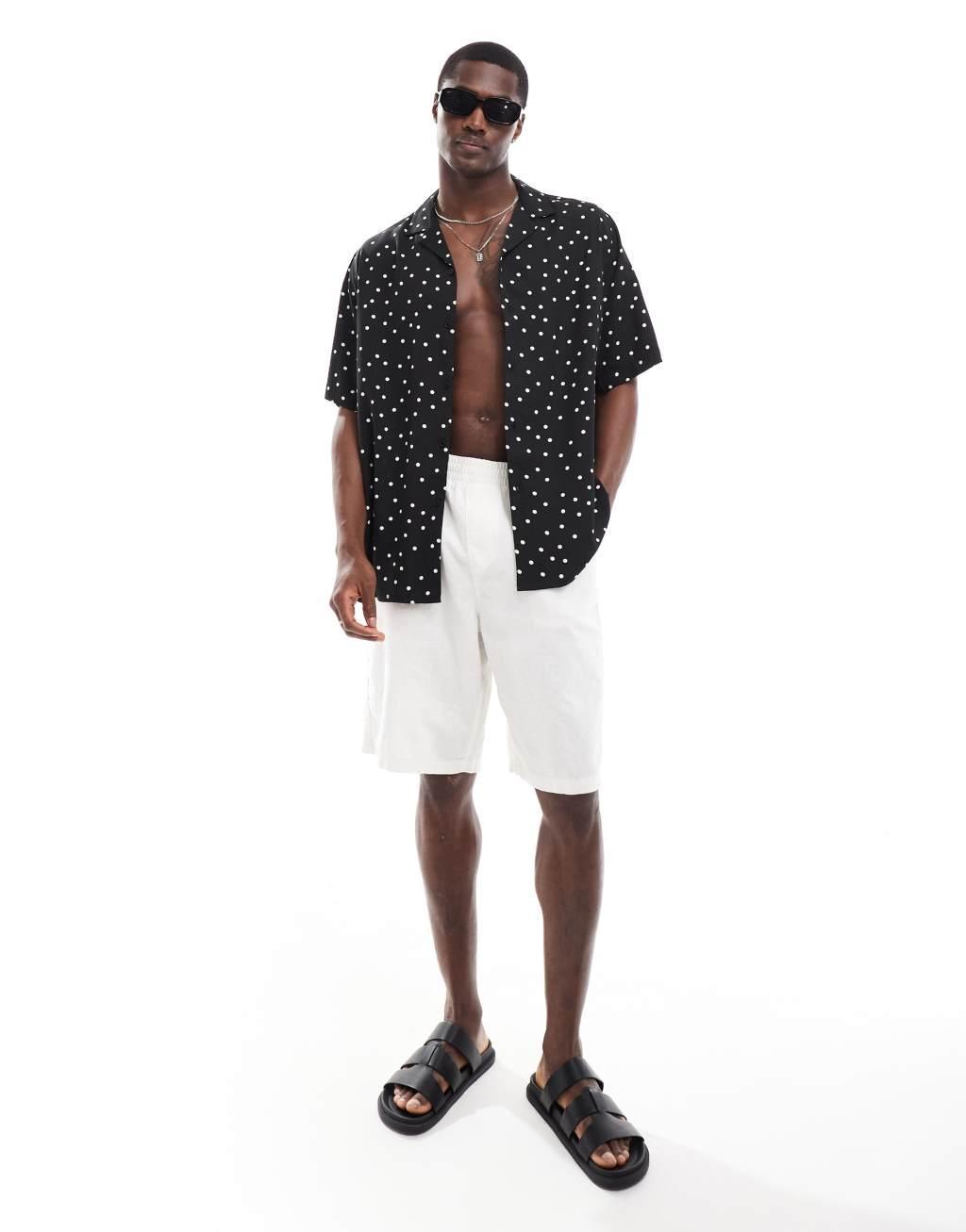 ASOS DESIGN relaxed revere shirt with polka dot print in black Product Image