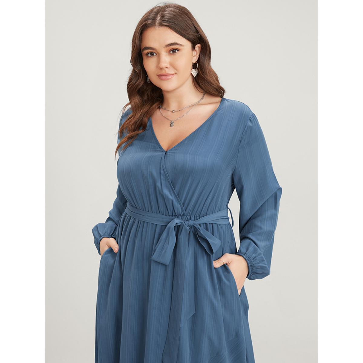 Plus Size Solid Surplice Neck Lantern Sleeve Pocket Belted Asymmetrical Hem Dress Cerulean Women Elegant Asymmetrical V-neck Long Sleeve Curvy Midi Dress BloomChic 22-24/3X Product Image
