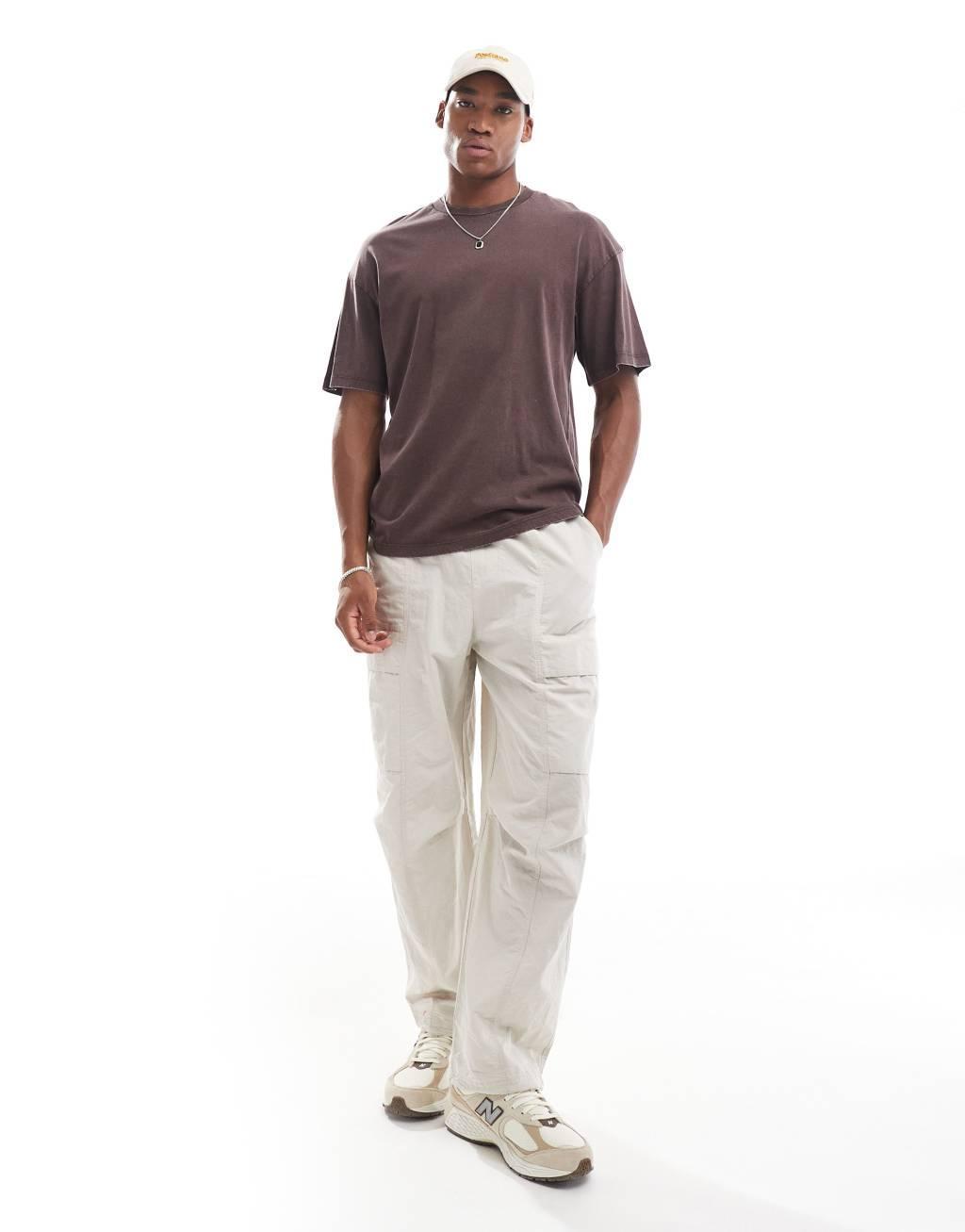 ADPT oversized washed sinister back print t-shirt in brown Product Image