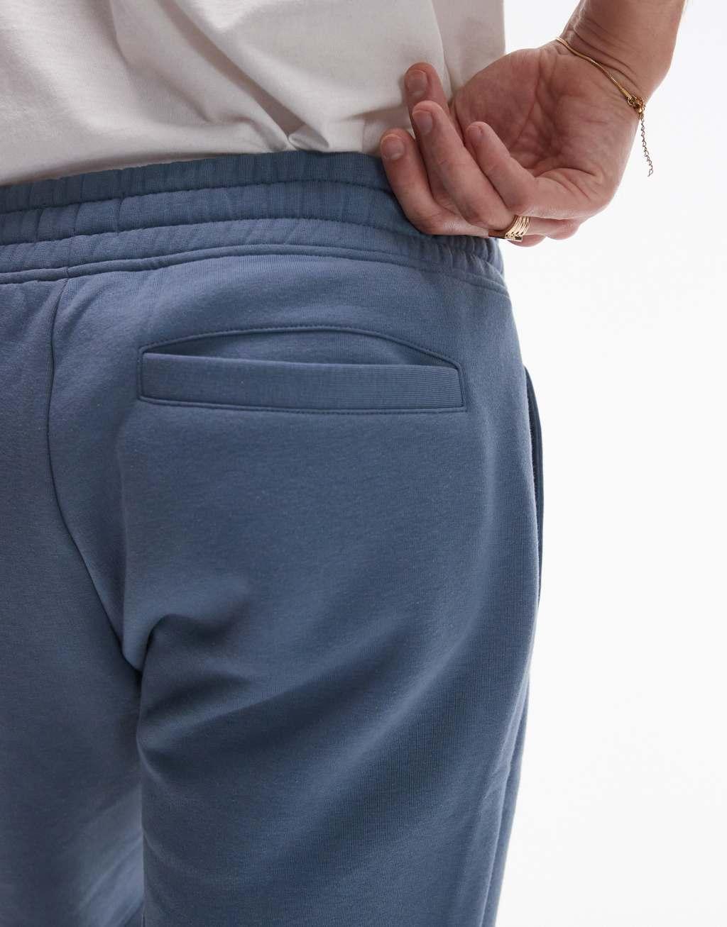 Topman classic fit jersey shorts with raw hem in blue Product Image