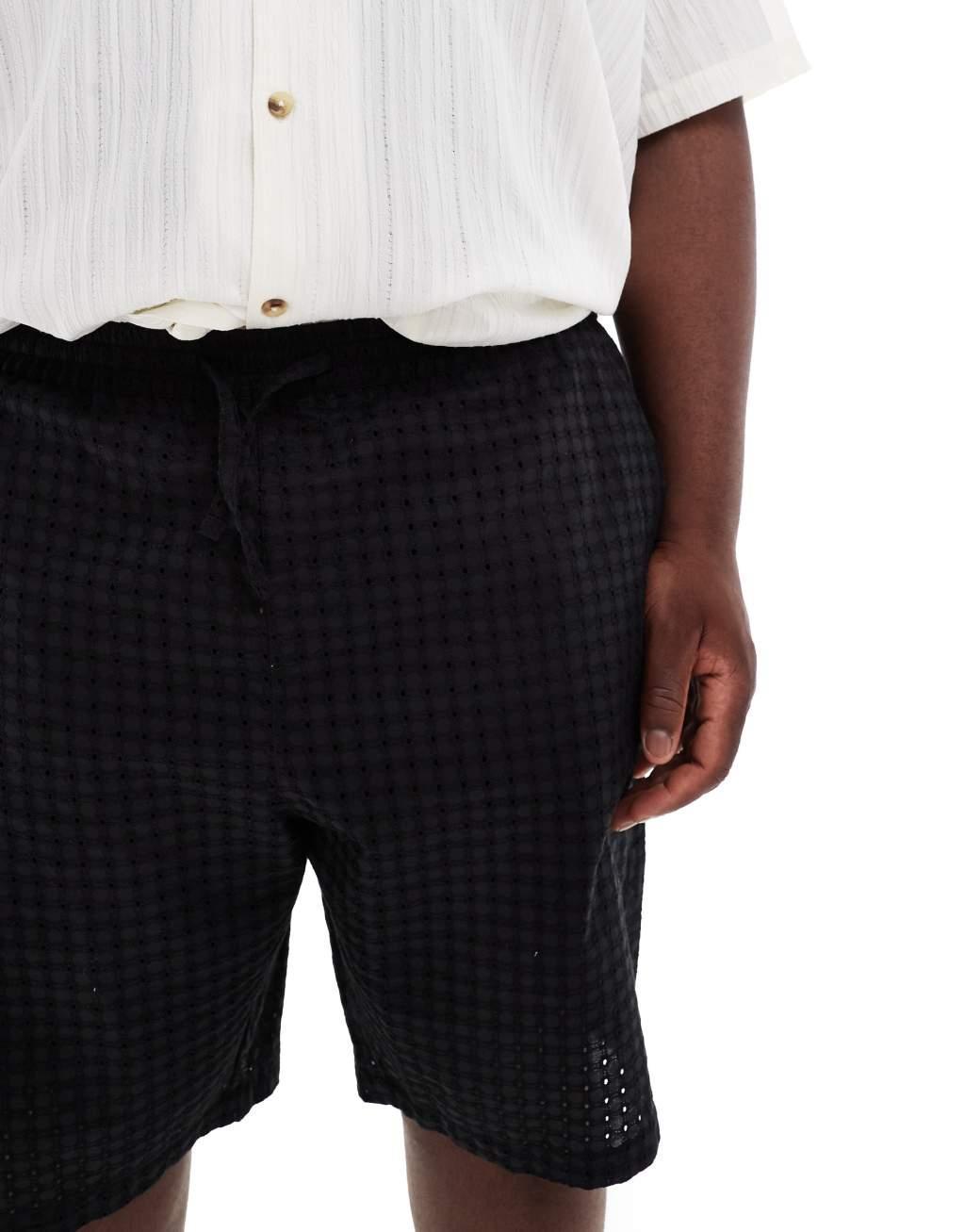 ASOS DESIGN eyelet shorts in black Product Image