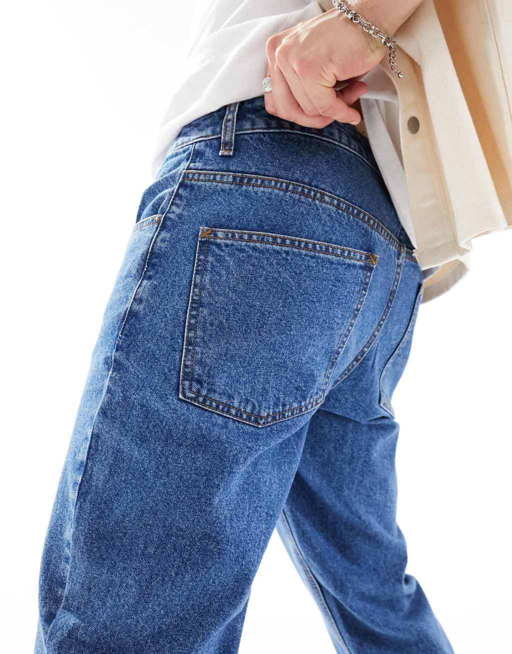 ASOS DESIGN tapered fit jeans in mid wash blue  Product Image