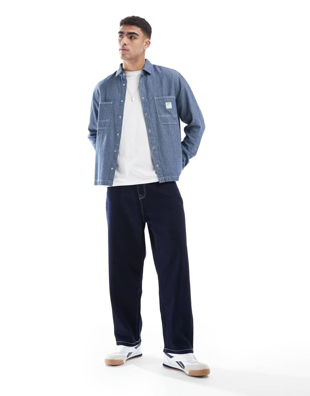ASOS DESIGN boxy relaxed denim shirt with badge in navy stripe Product Image