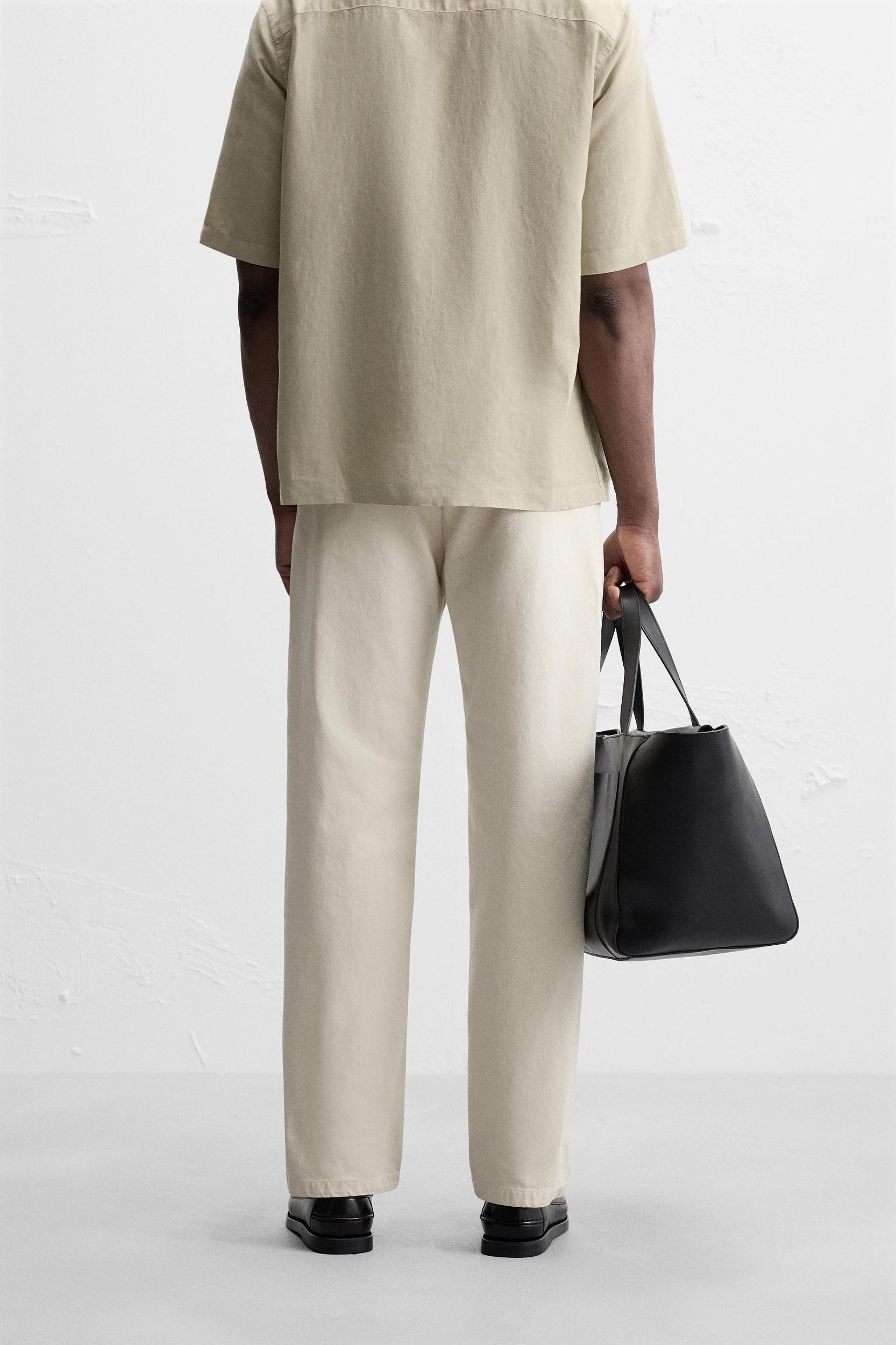 PLEATED STRAIGHT FIT PANTS Product Image