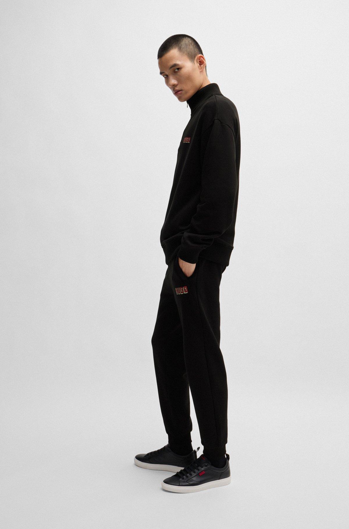Cotton-terry tracksuit bottoms with logo print Product Image