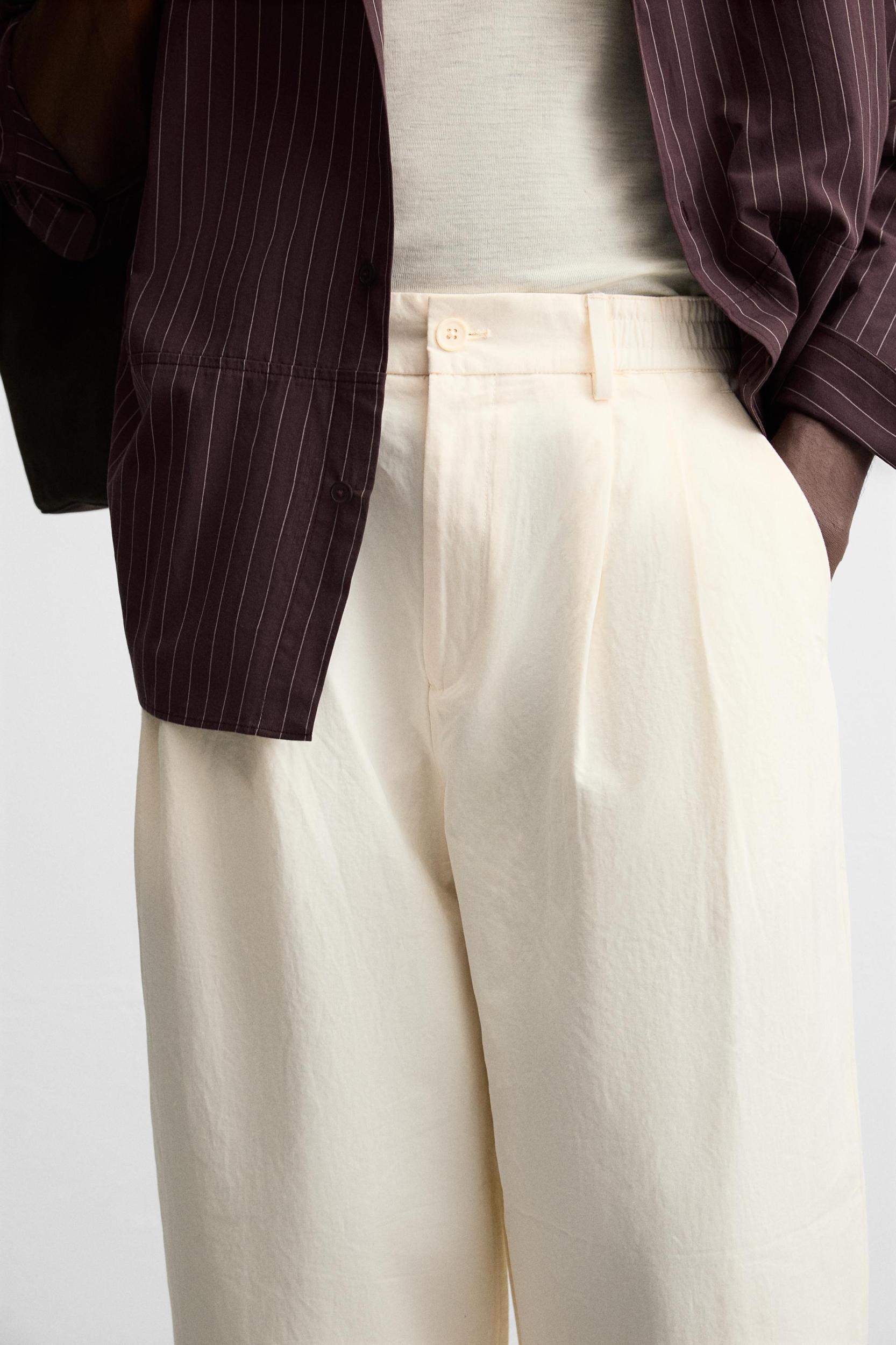 PLEATED CHINO PANTS Product Image