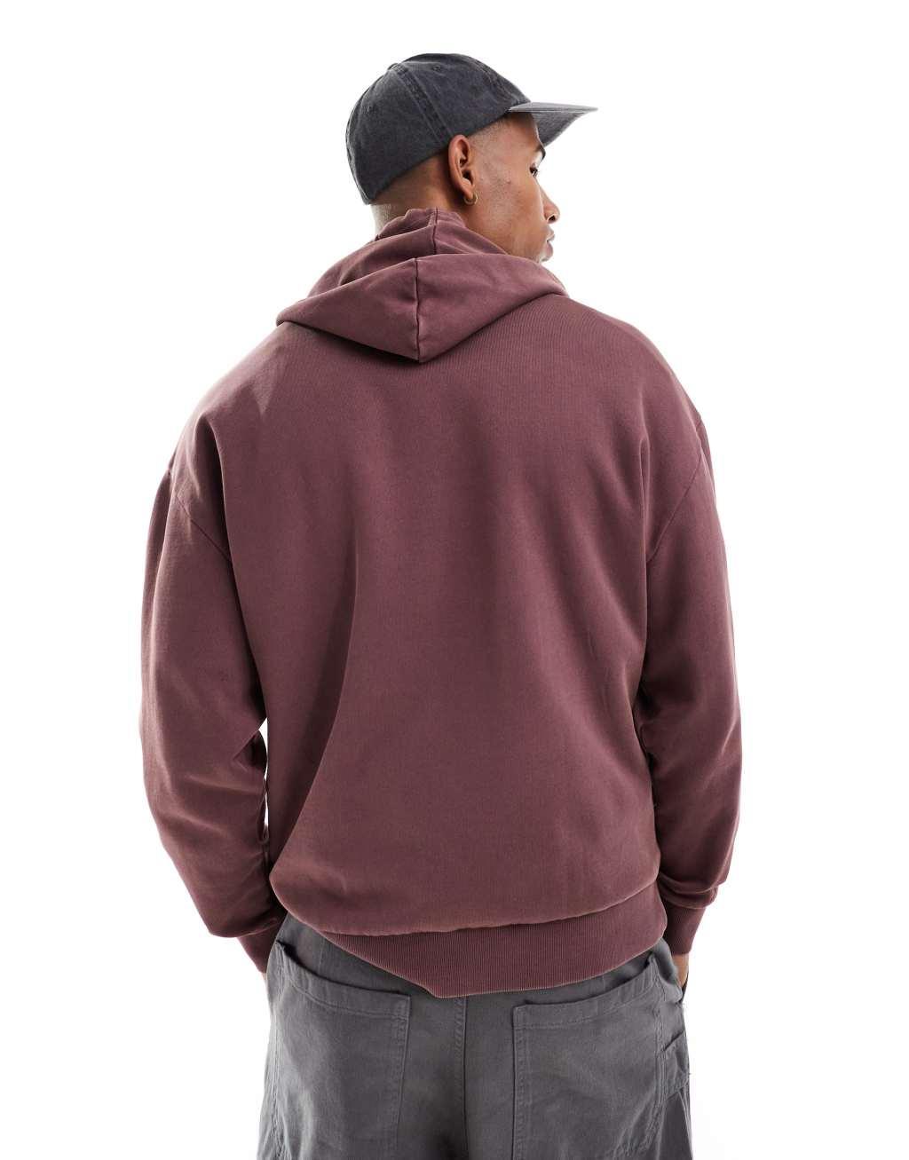 ASOS DESIGN essential oversized hoodie in acid wash burgundy Product Image