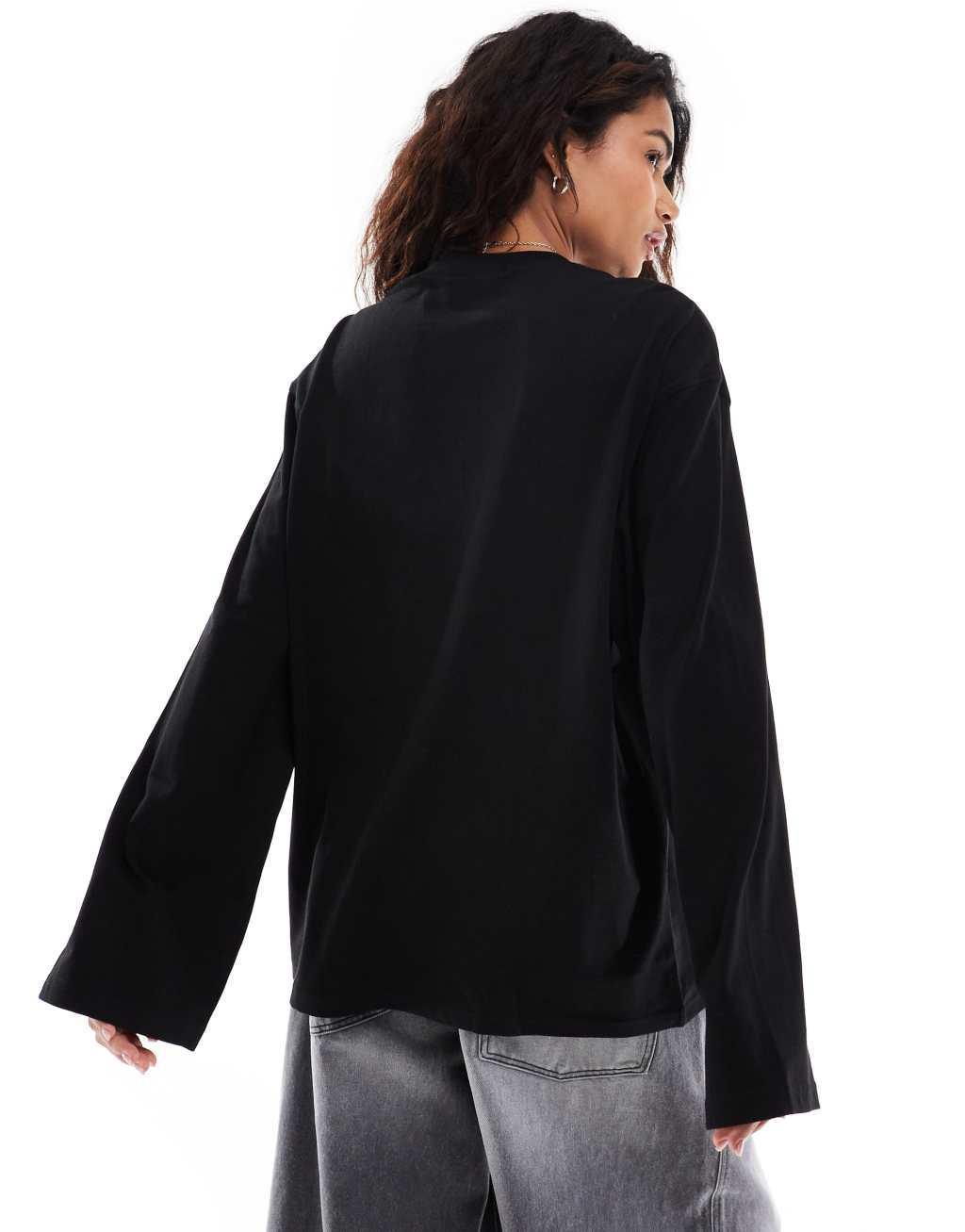 Weekday oversized long sleeve top in black Product Image