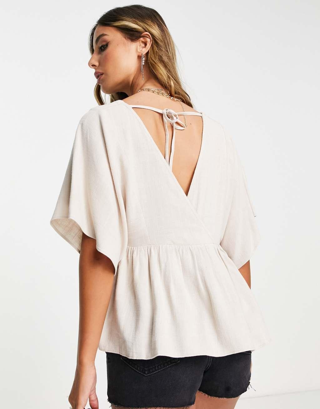 ASOS DESIGN wrap top with angel sleeve & peplum hem Product Image