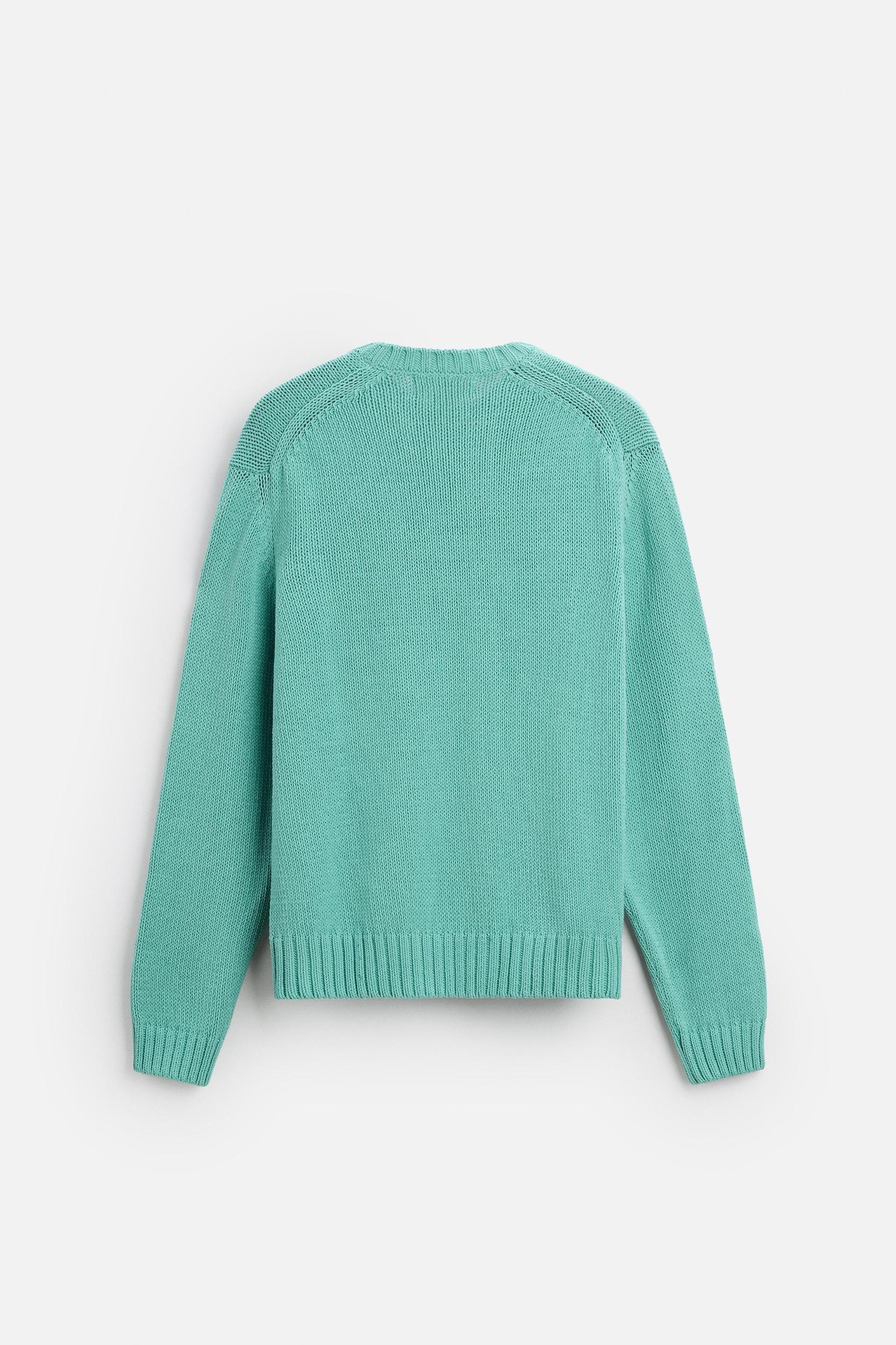 Relaxed fit cotton blend sweater. Round neck and long sleeves. Rib trim. Product Image