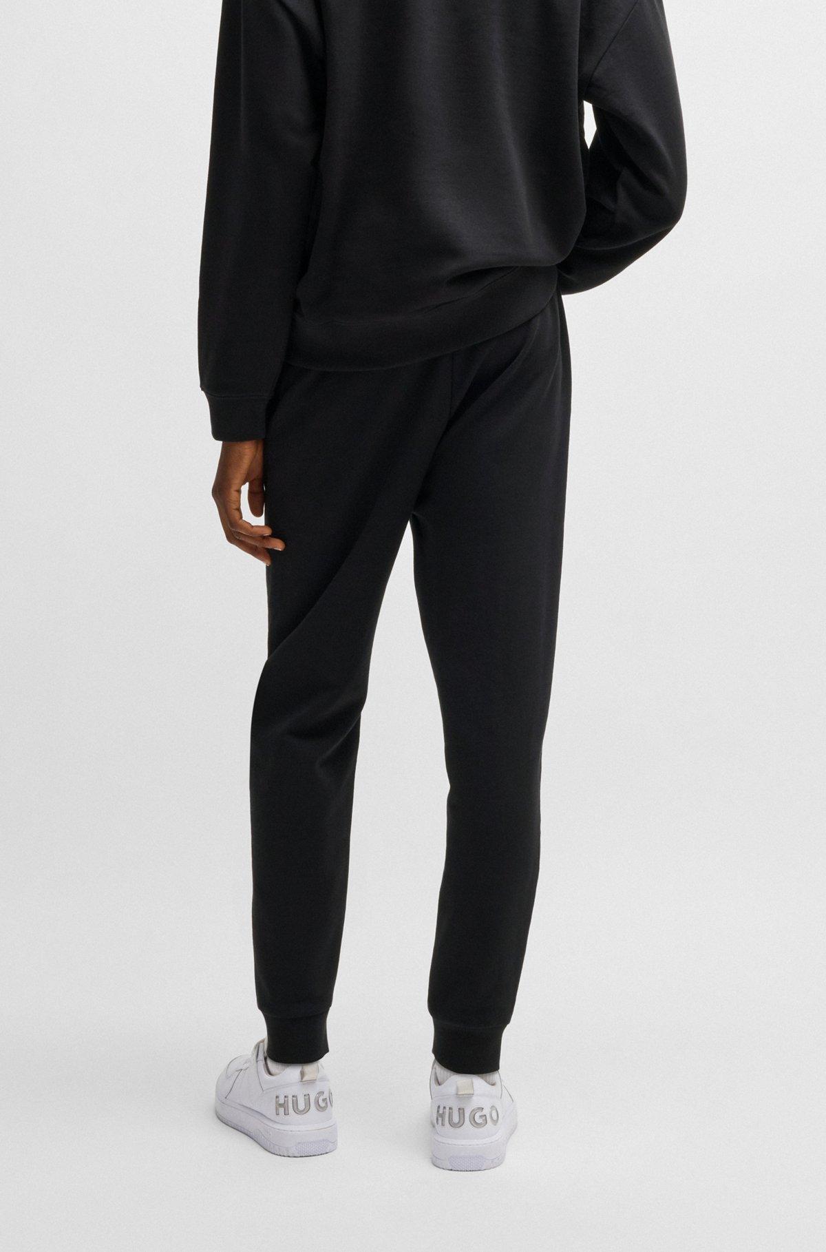 Cotton-terry tracksuit bottoms with logo print Product Image
