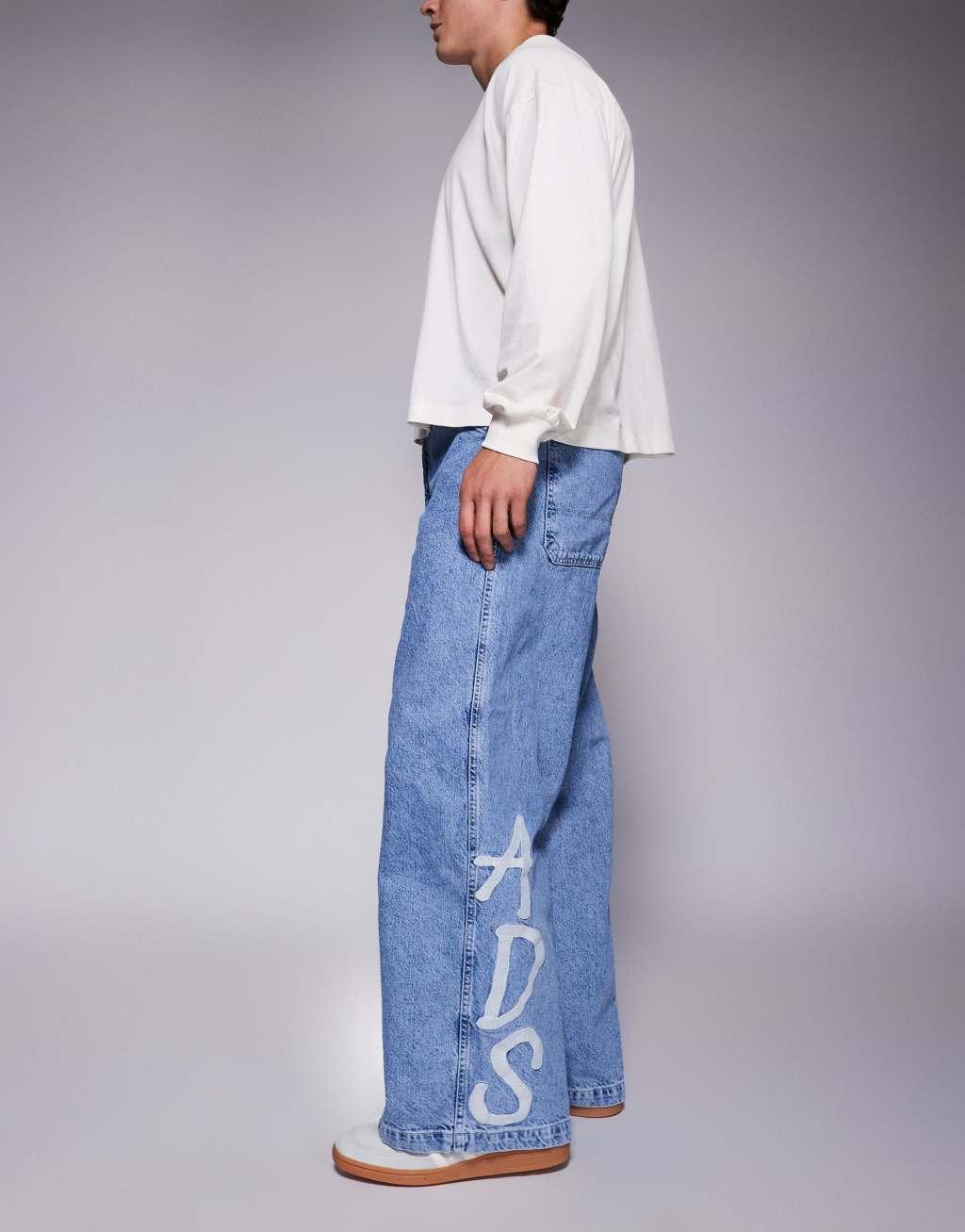 ASOS DESIGN super baggy jeans with ADS logo in mid wash blue Product Image