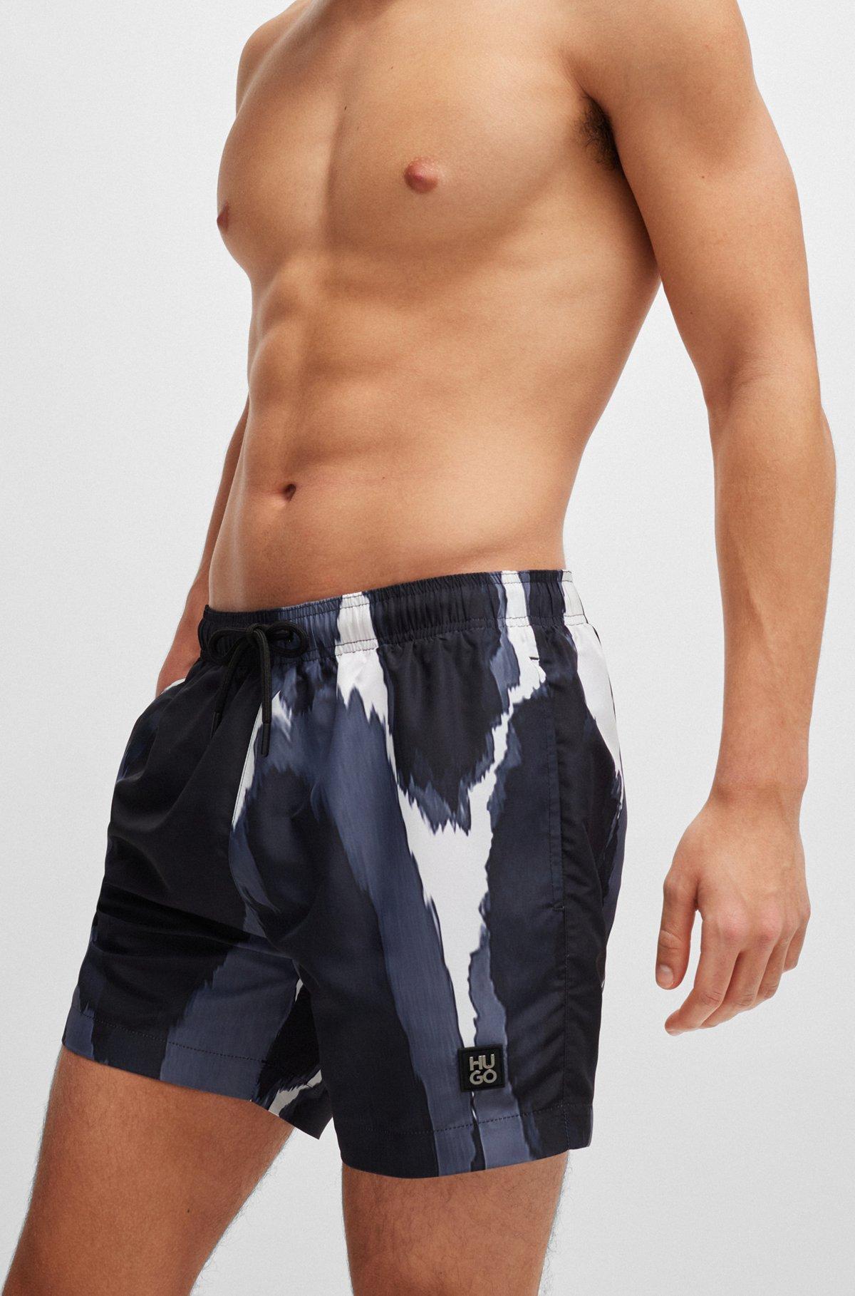 Seasonal-print quick-dry swim shorts with metallic logo Product Image