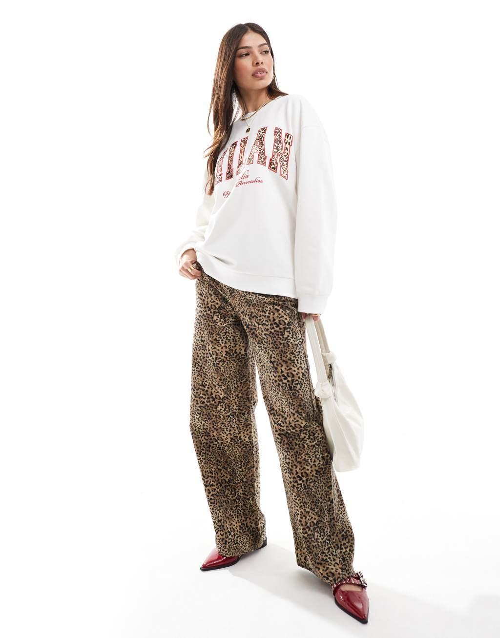 ASOS DESIGN sweatshirt with milan graphic in leopard in cream Product Image