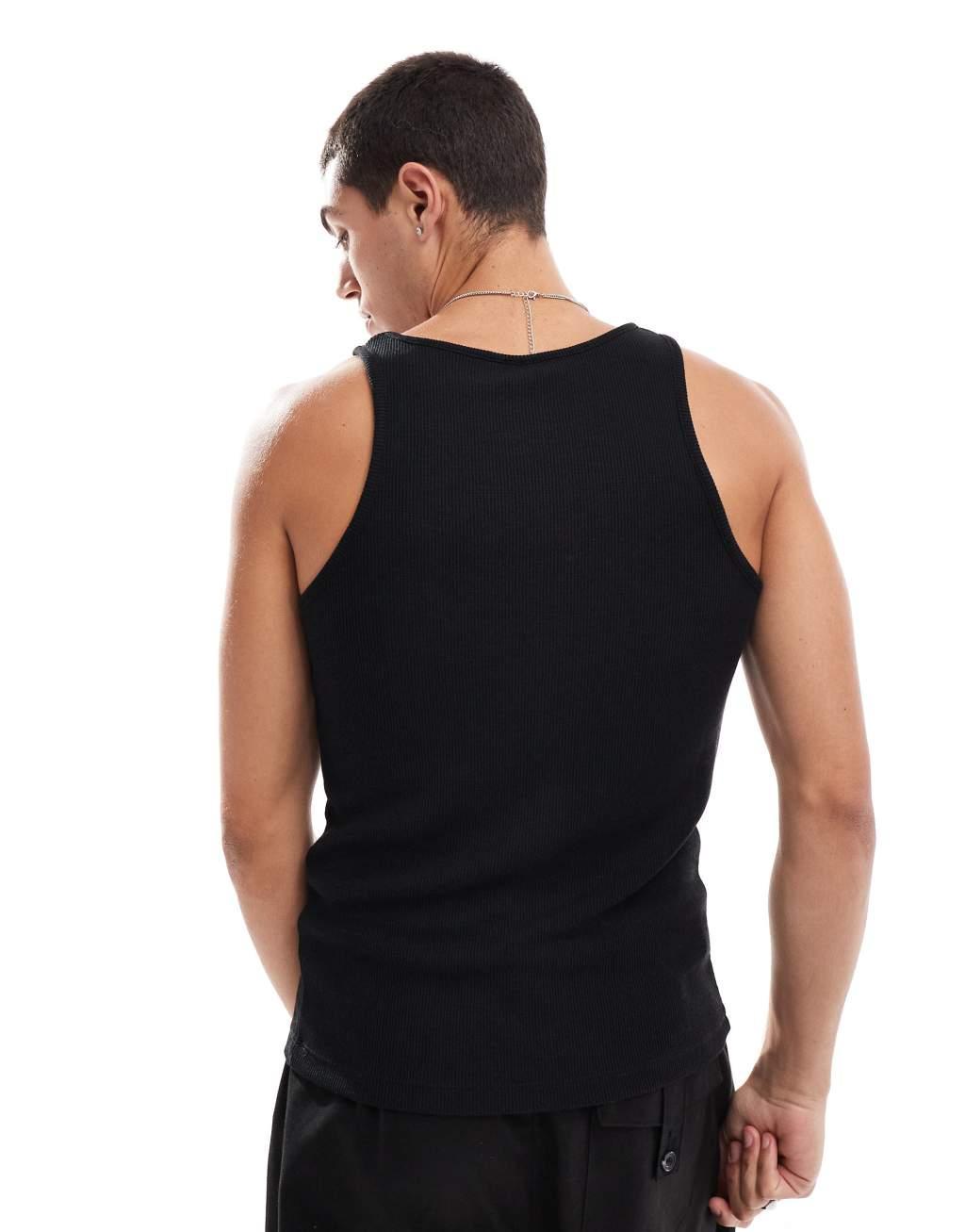 ASOS DESIGN muscle fit waffle textured tank top in black Product Image