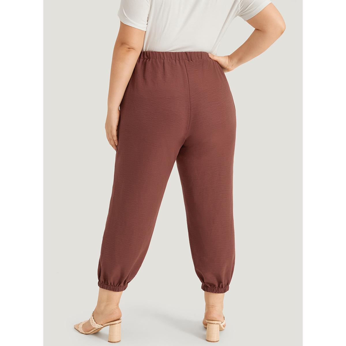 Plus Size Solid Patched Pocket Bowknot Button Detail Pants Women Rust Casual High Rise Dailywear Pants BloomChic 26/4X Product Image