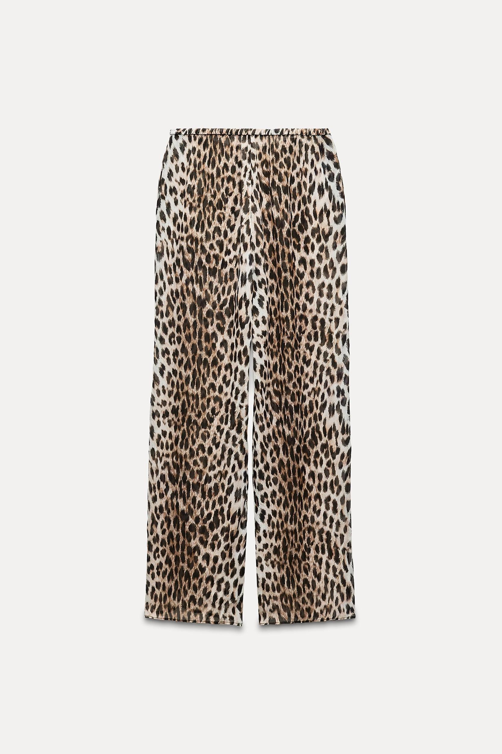 ZARA WOMAN COLLECTION<br/><br/>Pants made of 100% viscose.Mid-rise elastic waistband. Straight leg. Product Image