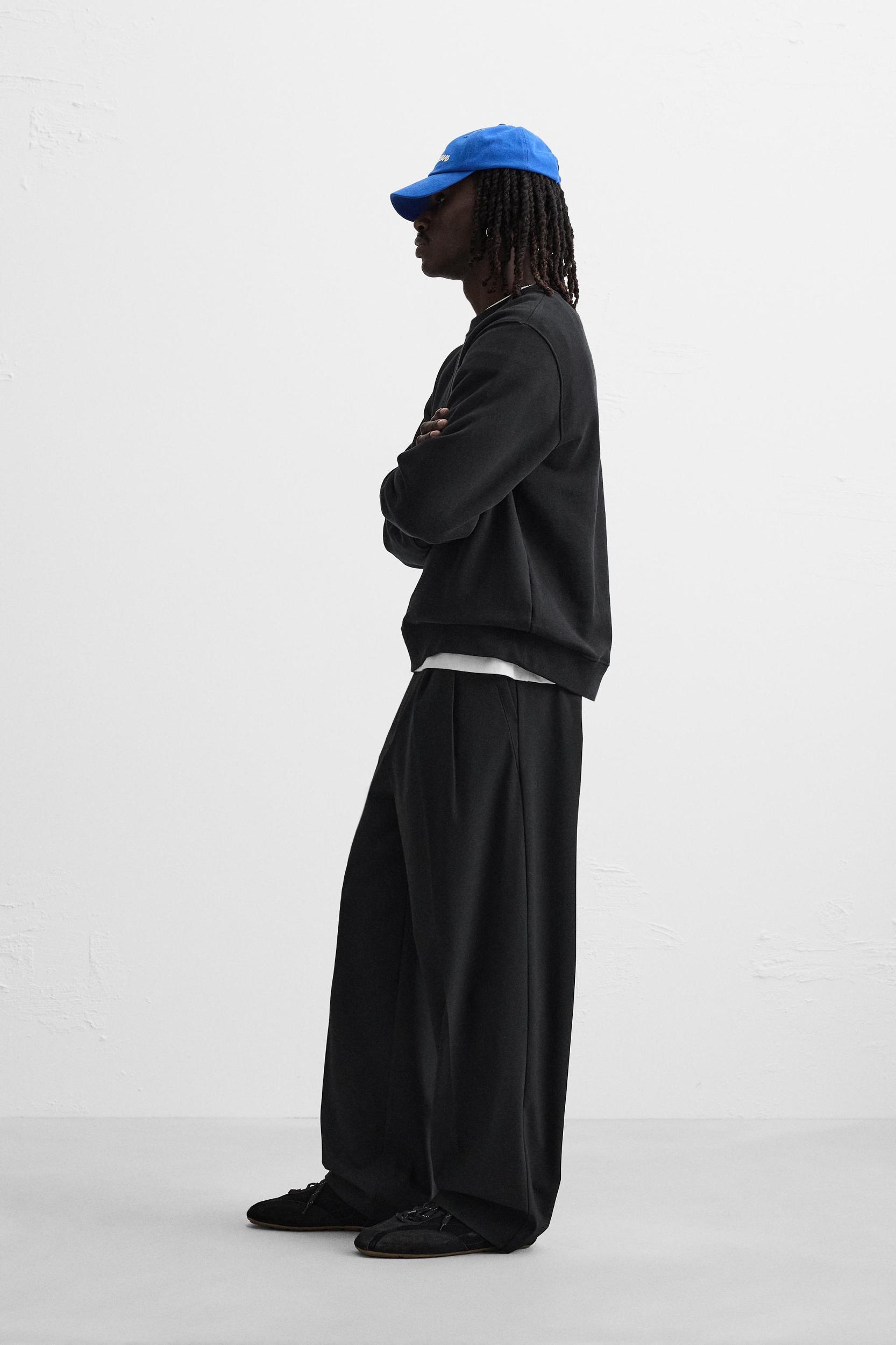 PLEATED WIDE FIT PANTS Product Image