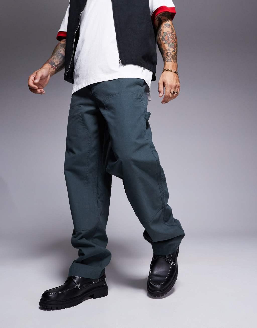 ASOS DESIGN baggy fit chino pants with carpenter detail in khaki Product Image