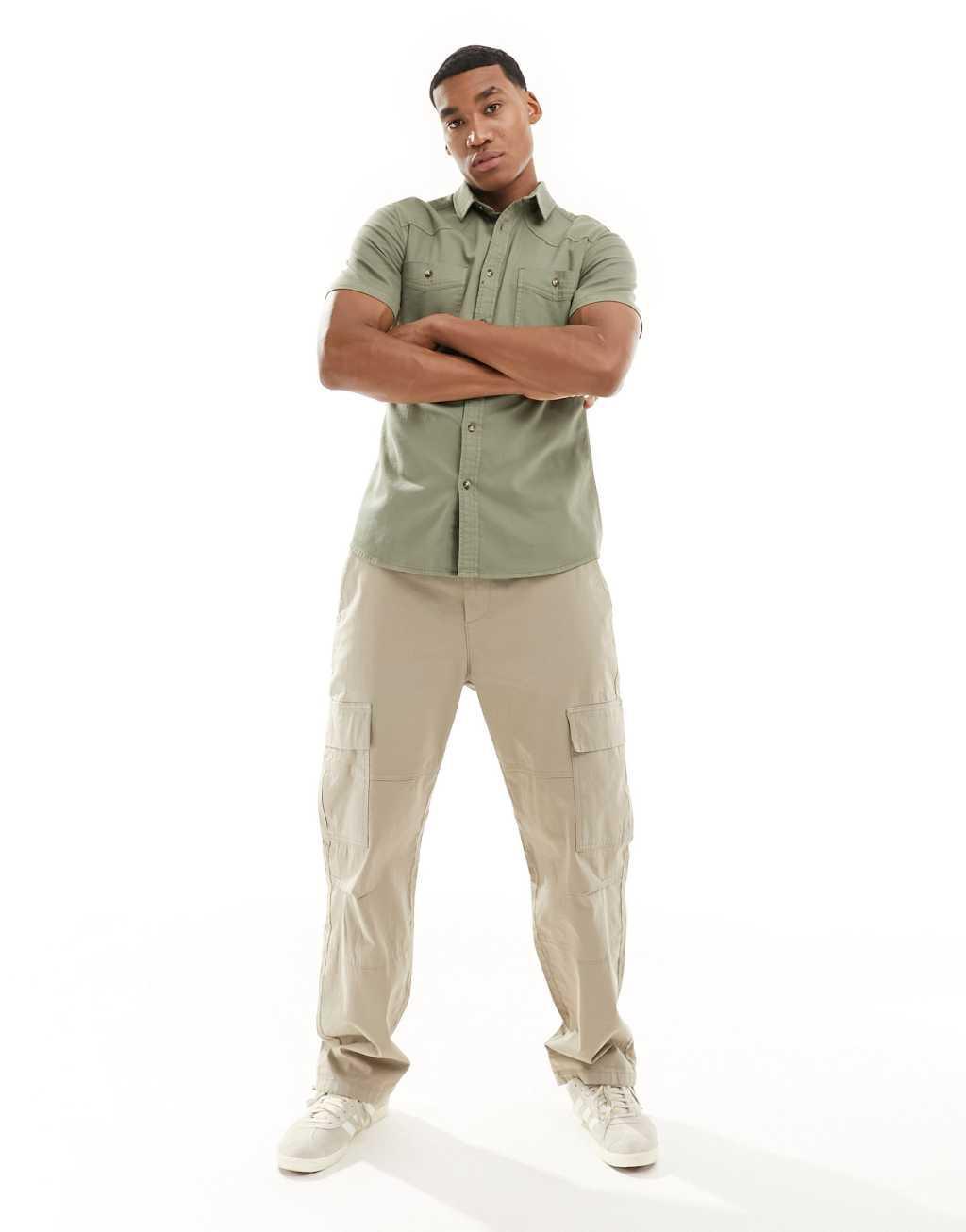 ASOS DESIGN short sleeve slim western denim shirt in khaki green Product Image