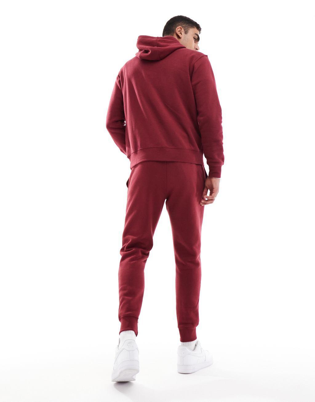 NIKE Club Cuffed Sweatpants In Red Product Image