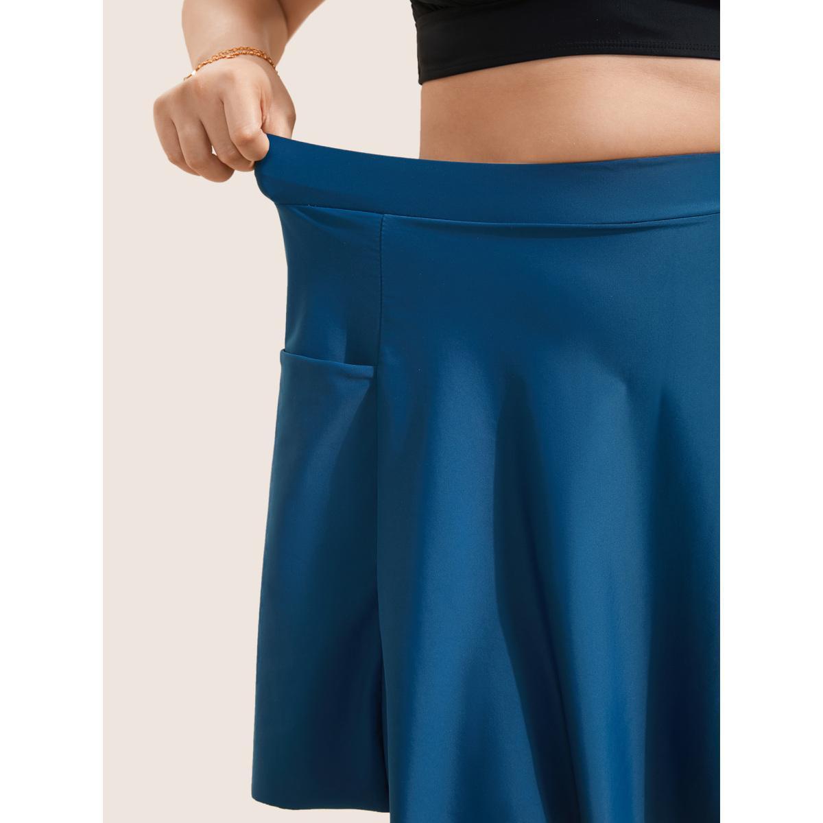Plus Size Solid Patched Pocket Side Pleated Swim Skirt Women's Swimwear Indigo Beach Non High stretch Bodycon High Rise Slanted pocket Curve Swim Bottoms BloomChic 10/M Product Image