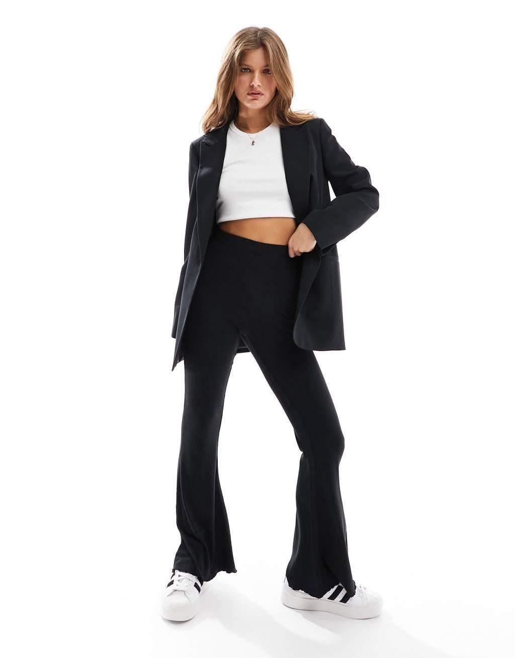 ASOS DESIGN Petite ribbed flare pants with lettuce hem Product Image