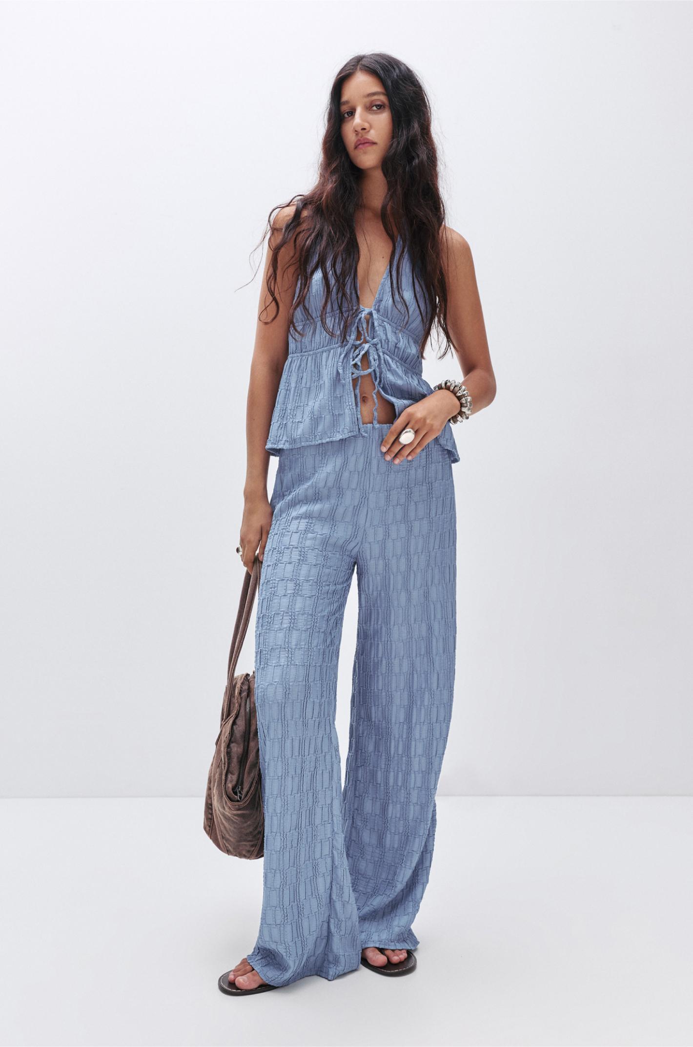 Textured bell bottom trousers Product Image