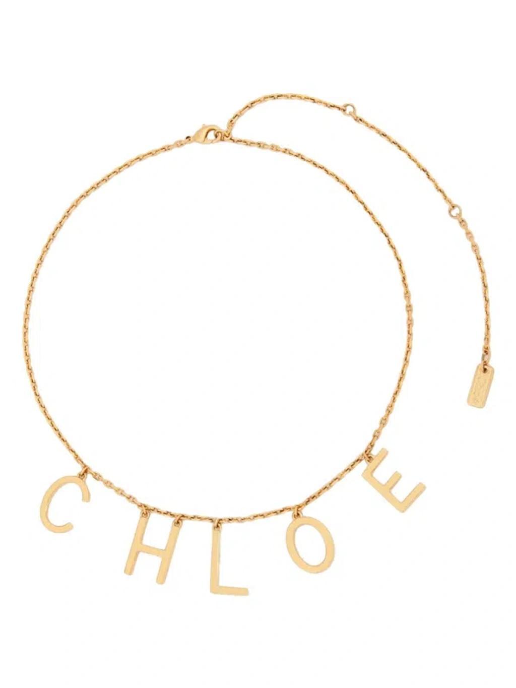 CHLOÉ Metallic Belt With Adjustable Hook Closure And Logo Lettering Charm In Brass Woman In Gold Product Image