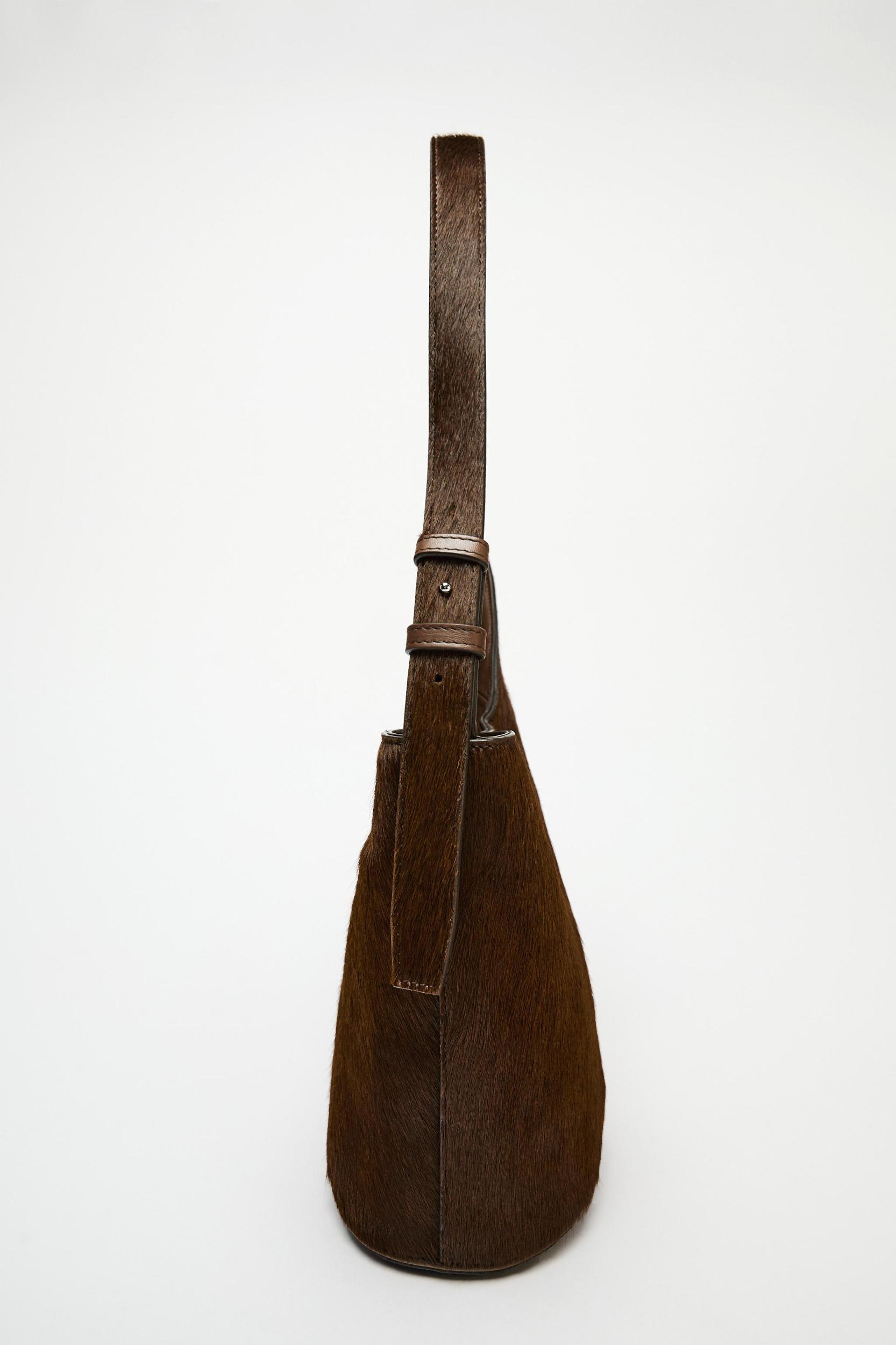 ASYMMETRIC FUR-TRIMMED LEATHER BUCKET BAG Product Image