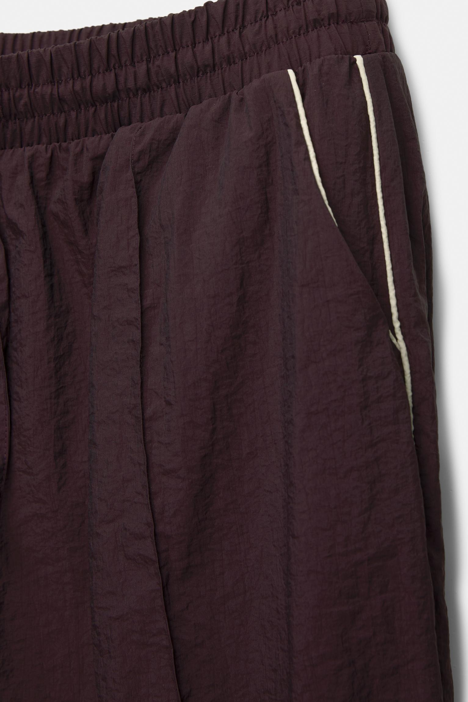 Tracksuit pants with side stripes Product Image