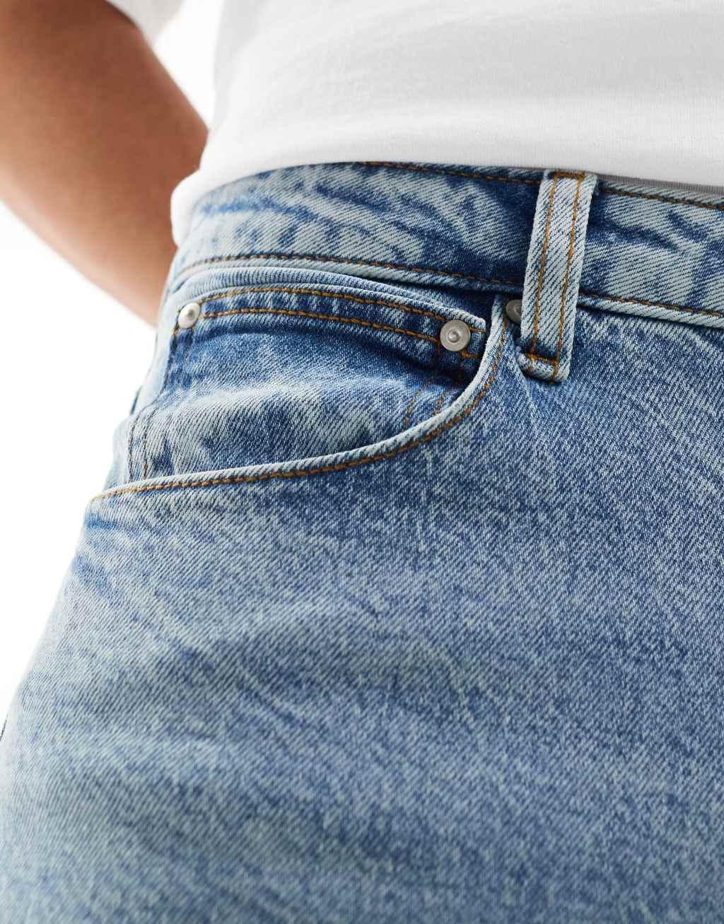 ASOS DESIGN stretch tapered jeans in light wash blue Product Image