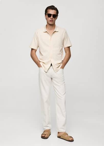 Regular-fit textured buttoned polo shirt - Men | MANGO USA Product Image