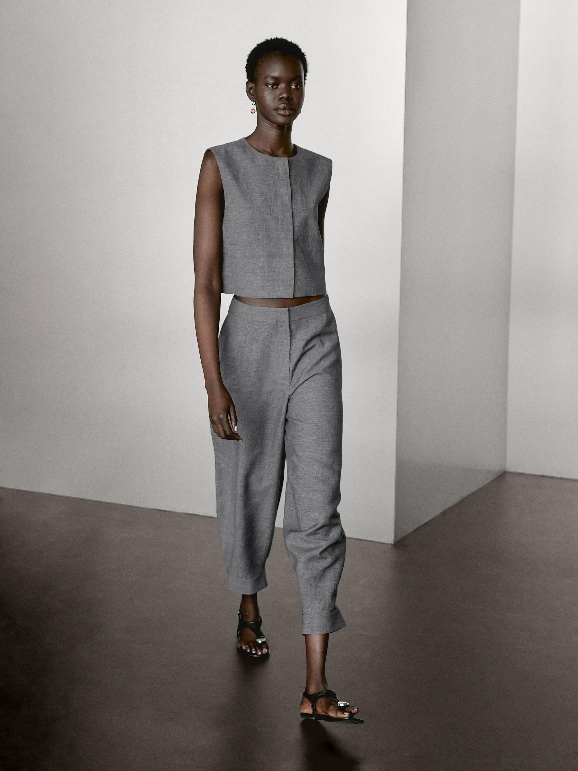 Balloon fit trousers with button details Product Image