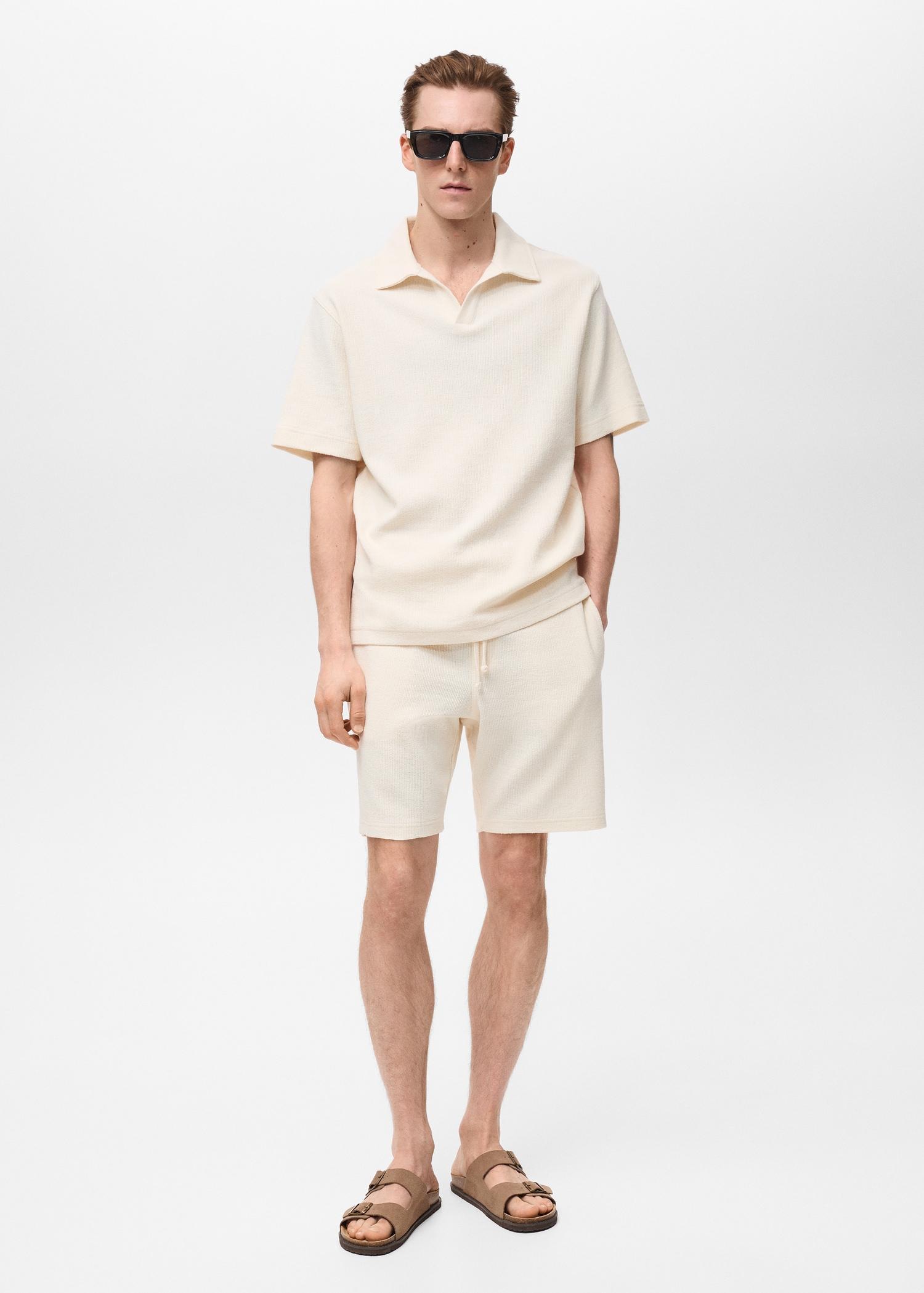 Regular-fit textured polo shirt - Men | MANGO USA Product Image