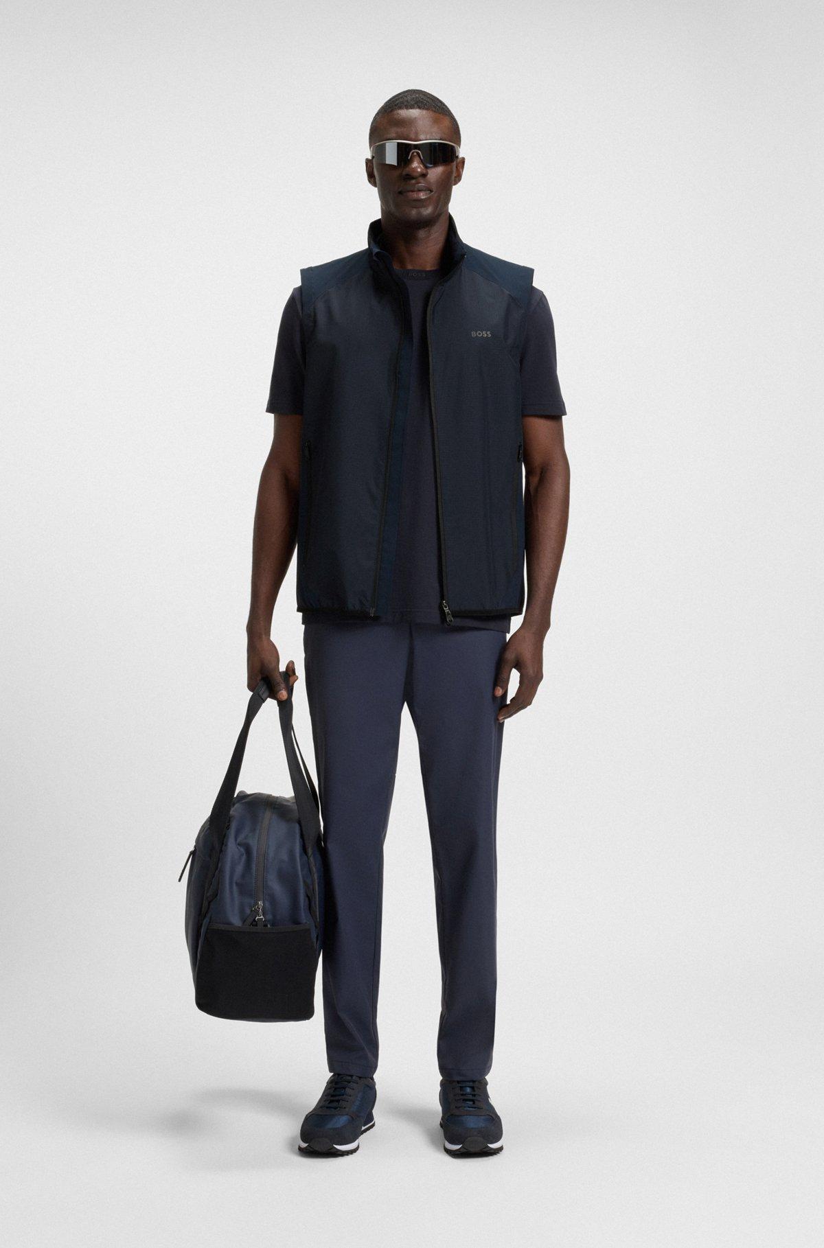 Water-repellent golf vest with decorative reflective details Product Image