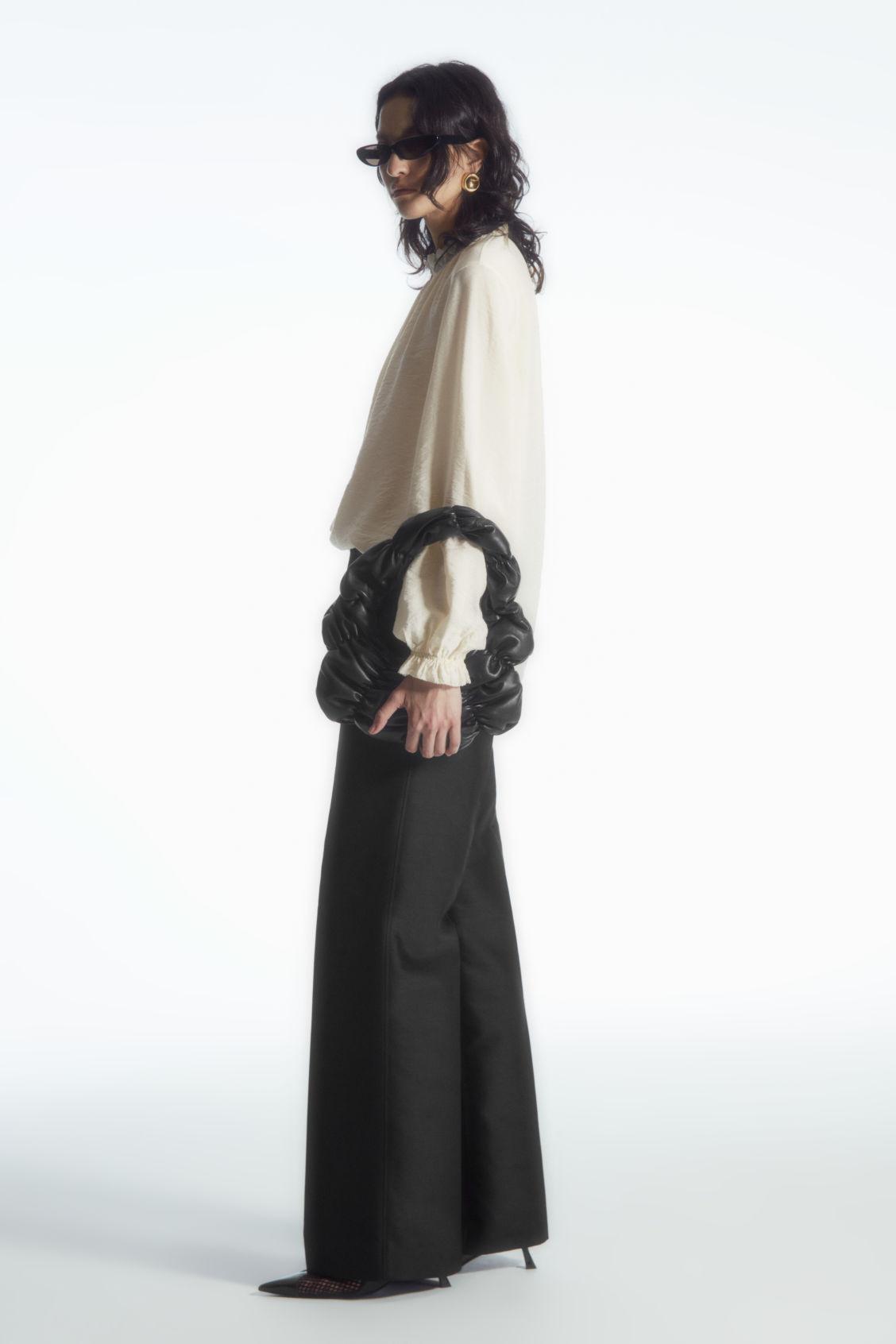 RUFFLED HIGH-NECK BLOUSE Product Image