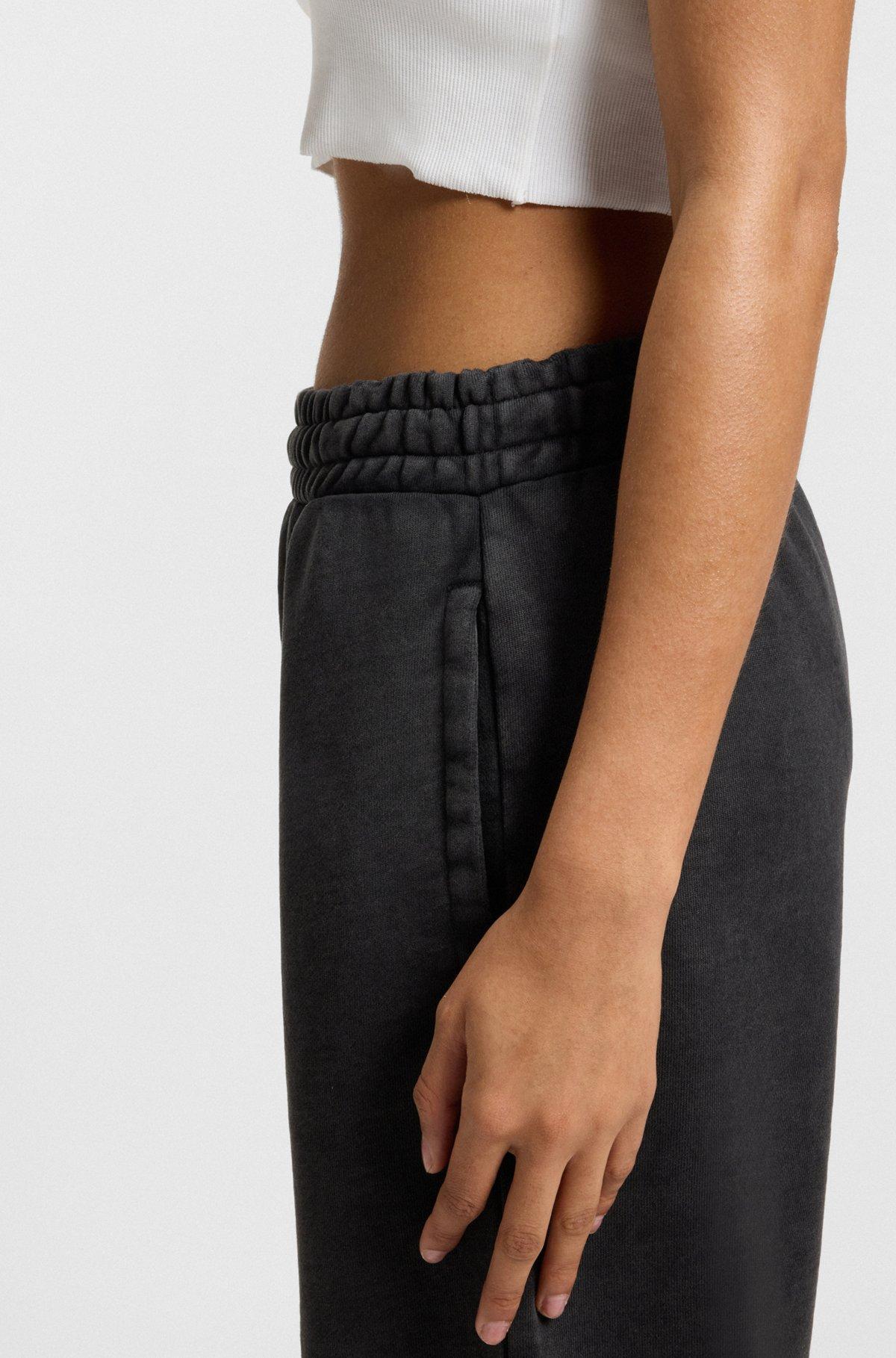 HUGO - Loose-fit tracksuit bottoms in cotton terry - Black Product Image