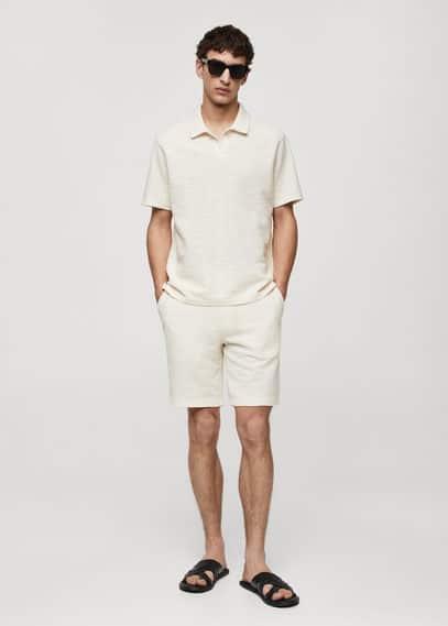 Regular-fit textured knitted polo shirt - Men | MANGO USA Product Image