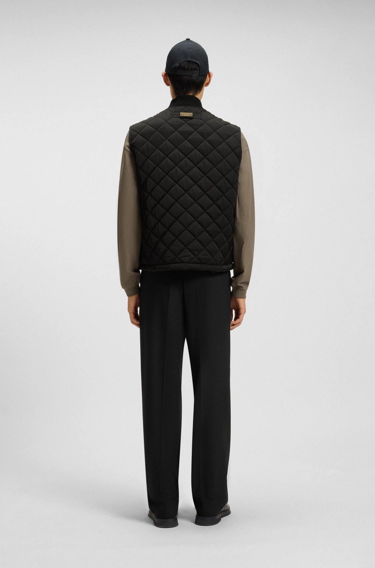 Water-repellent gilet in quilted satin with logo plaque Product Image