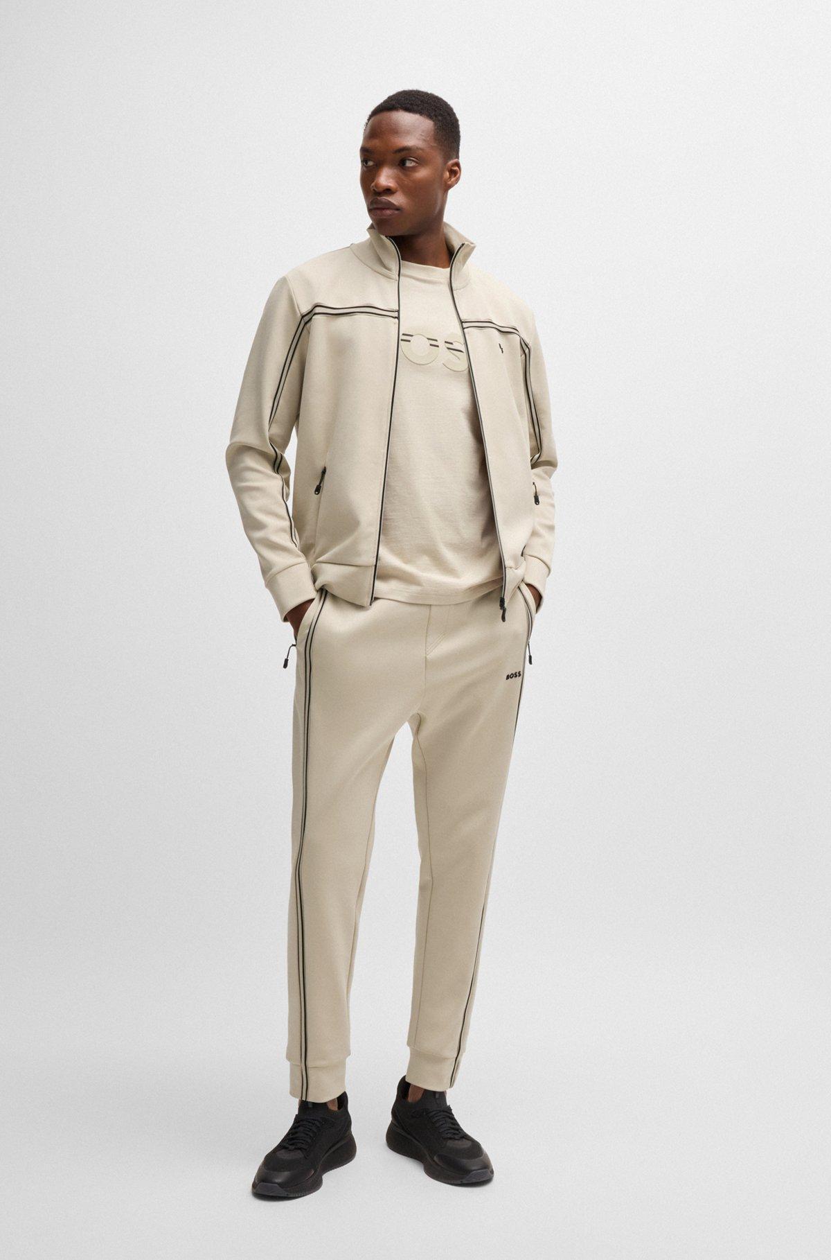 Tracksuit bottoms with tape inserts Product Image