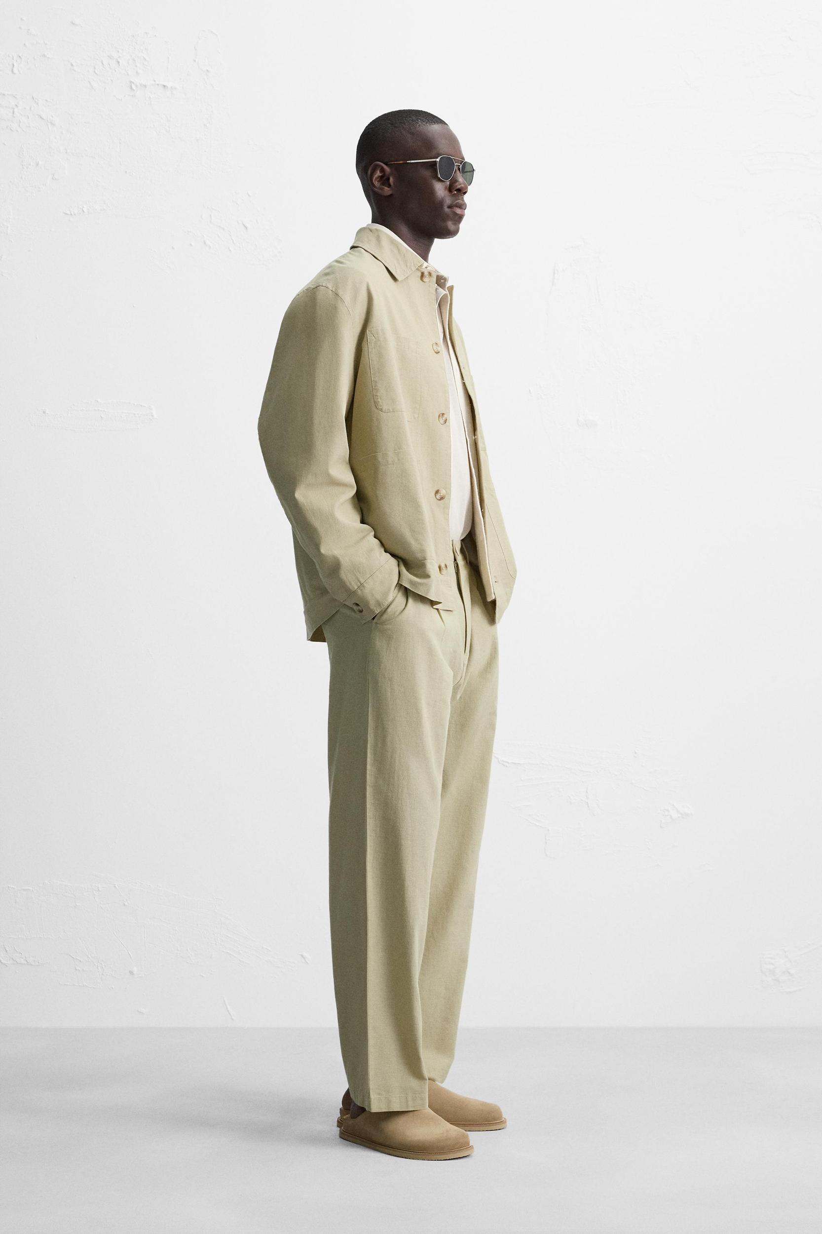 RELAXED FIT PLEATED PANTS Product Image