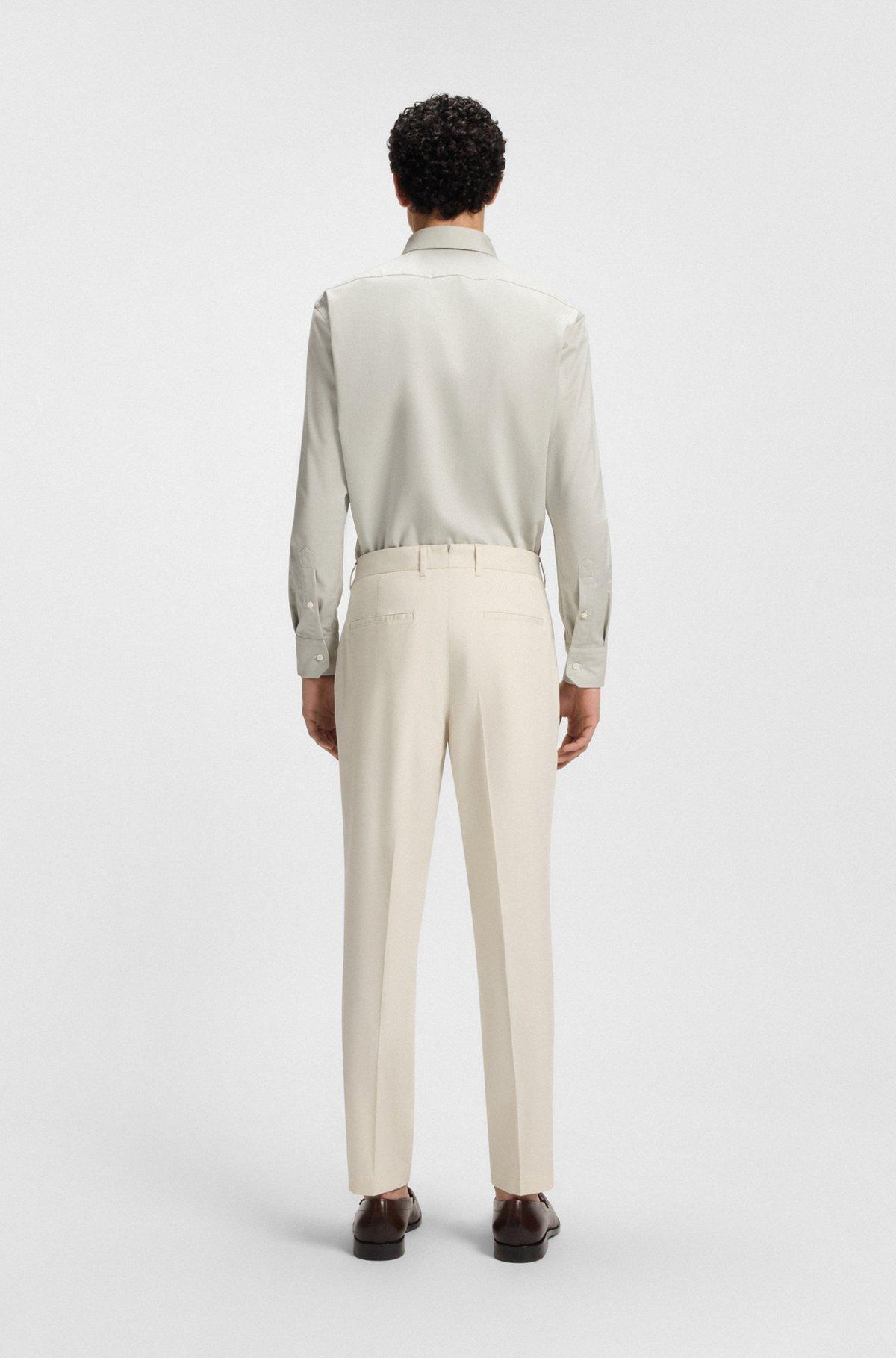 Machine-washable tapered-fit trousers in stretch fabric Product Image