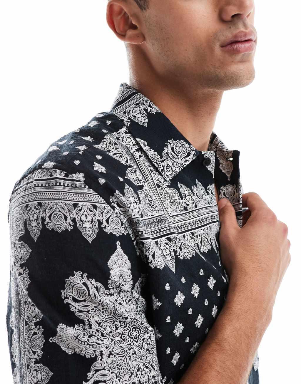 ASOS DESIGN relaxed shirt in textured bandana print in black Product Image