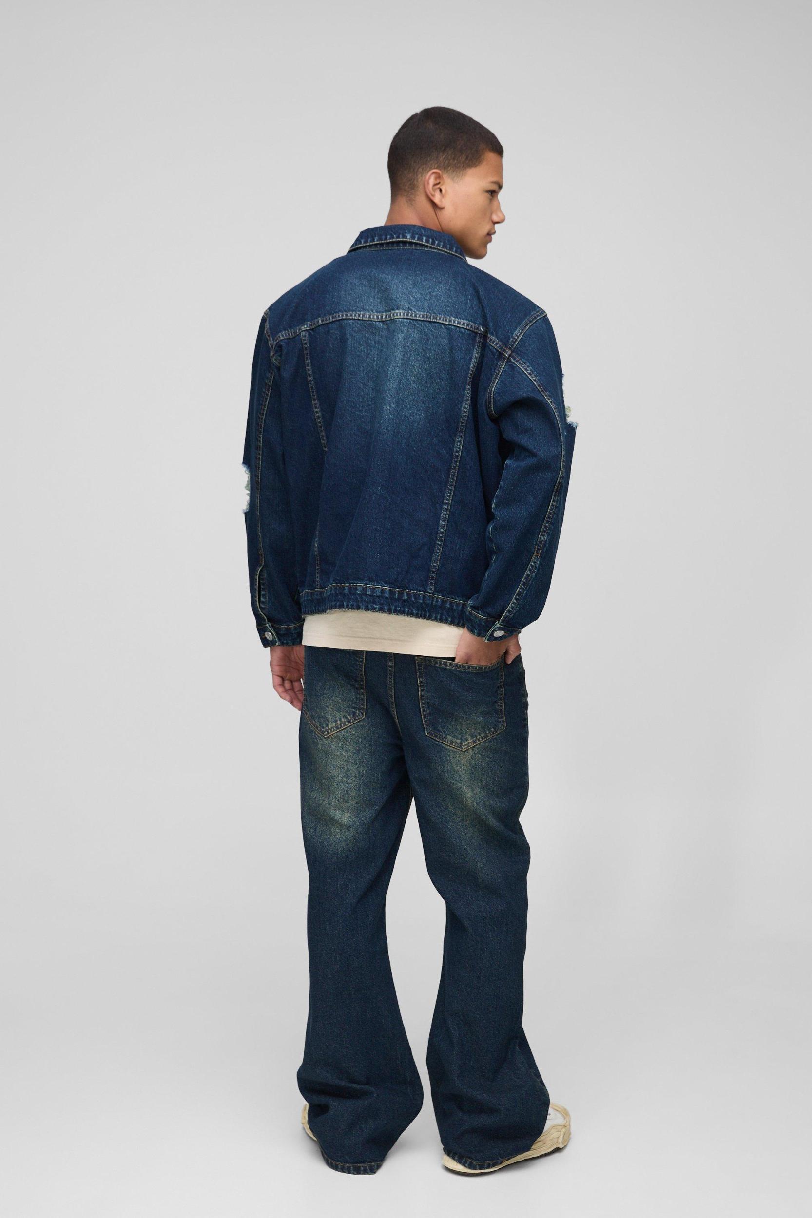 Relaxed Flare Antique Wash Ripped Knee Jeans | boohooMAN USA Product Image